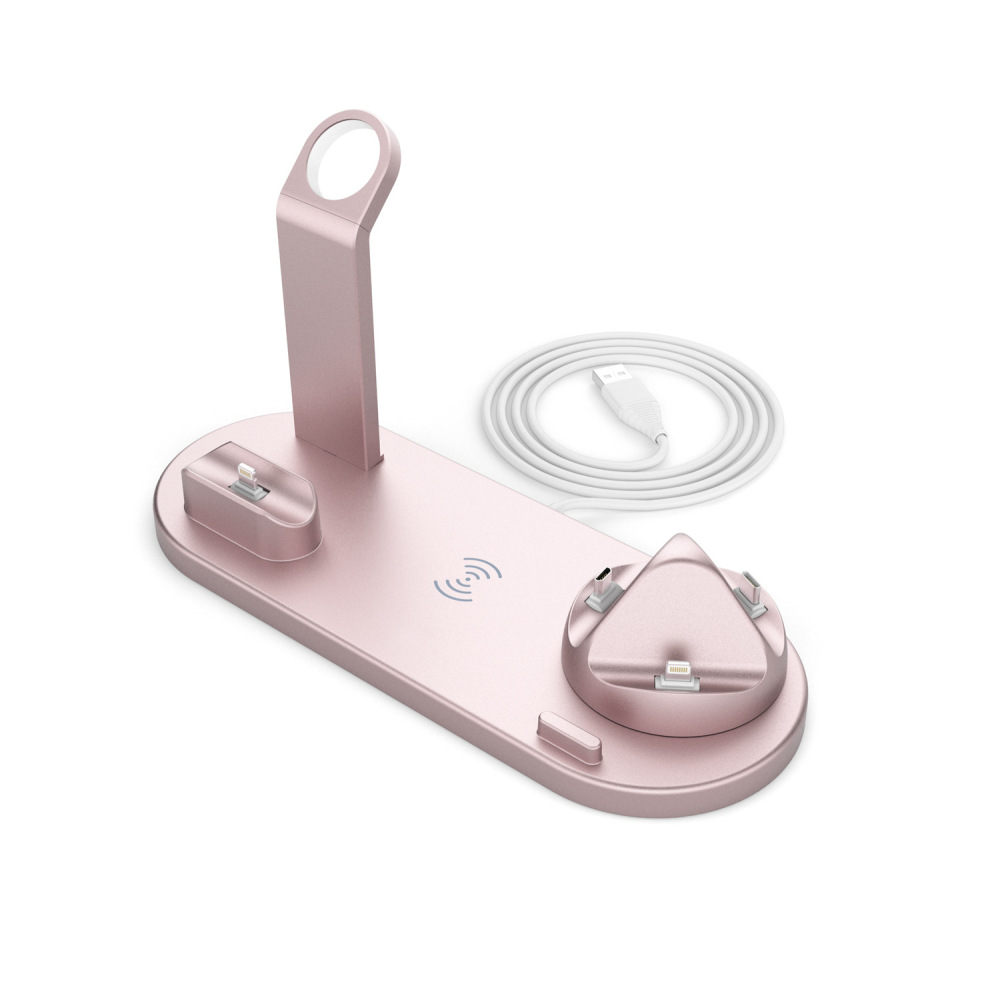 Ein roségoldener Ladeständer mit einem USB-Kabel vor einem weißen Hintergrund.