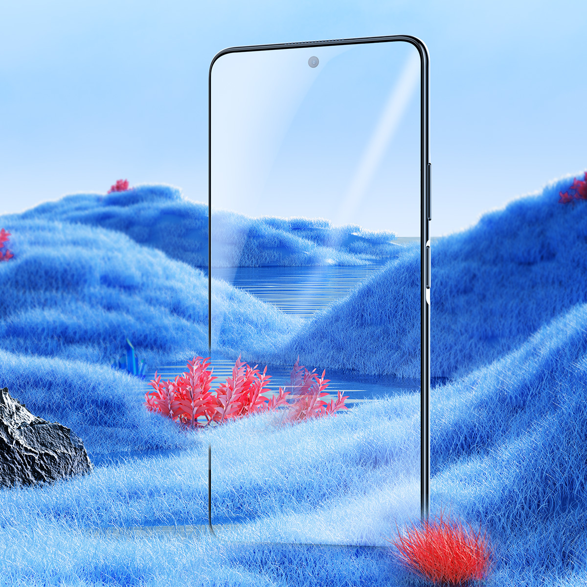 Un telefono con una protezione per lo schermo mostra un paesaggio con colline blu e piante rosse.