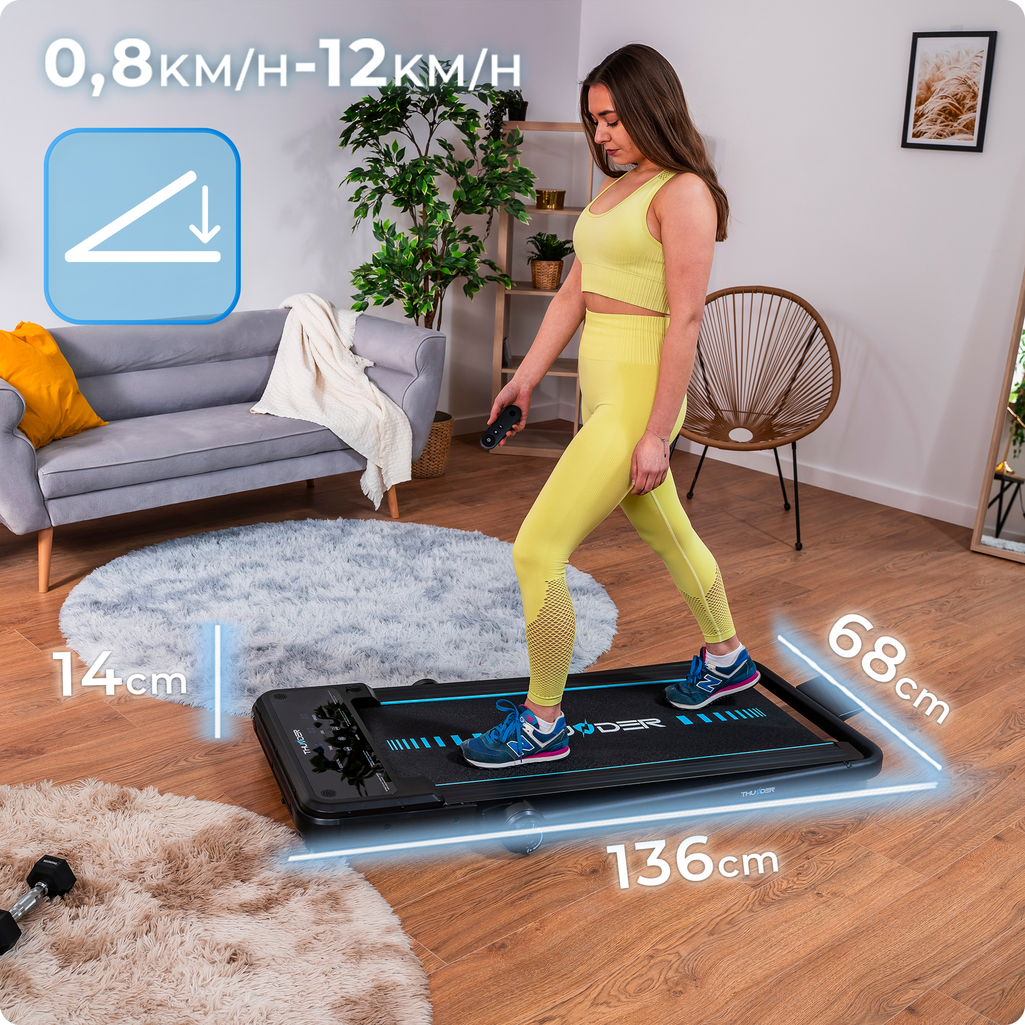 Kobieta idąca po czarnej bieżni. Żółty strój. Wskazano wymiary bieżni.