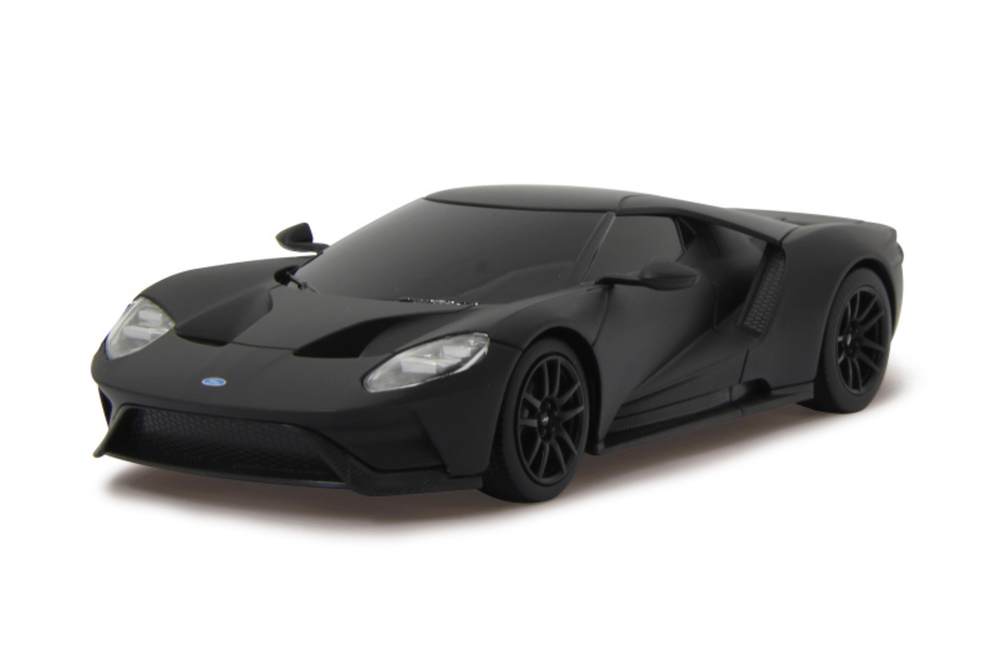 Ein mattes schwarzes Spielzeugauto wird auf einem weißen Hintergrund gezeigt.