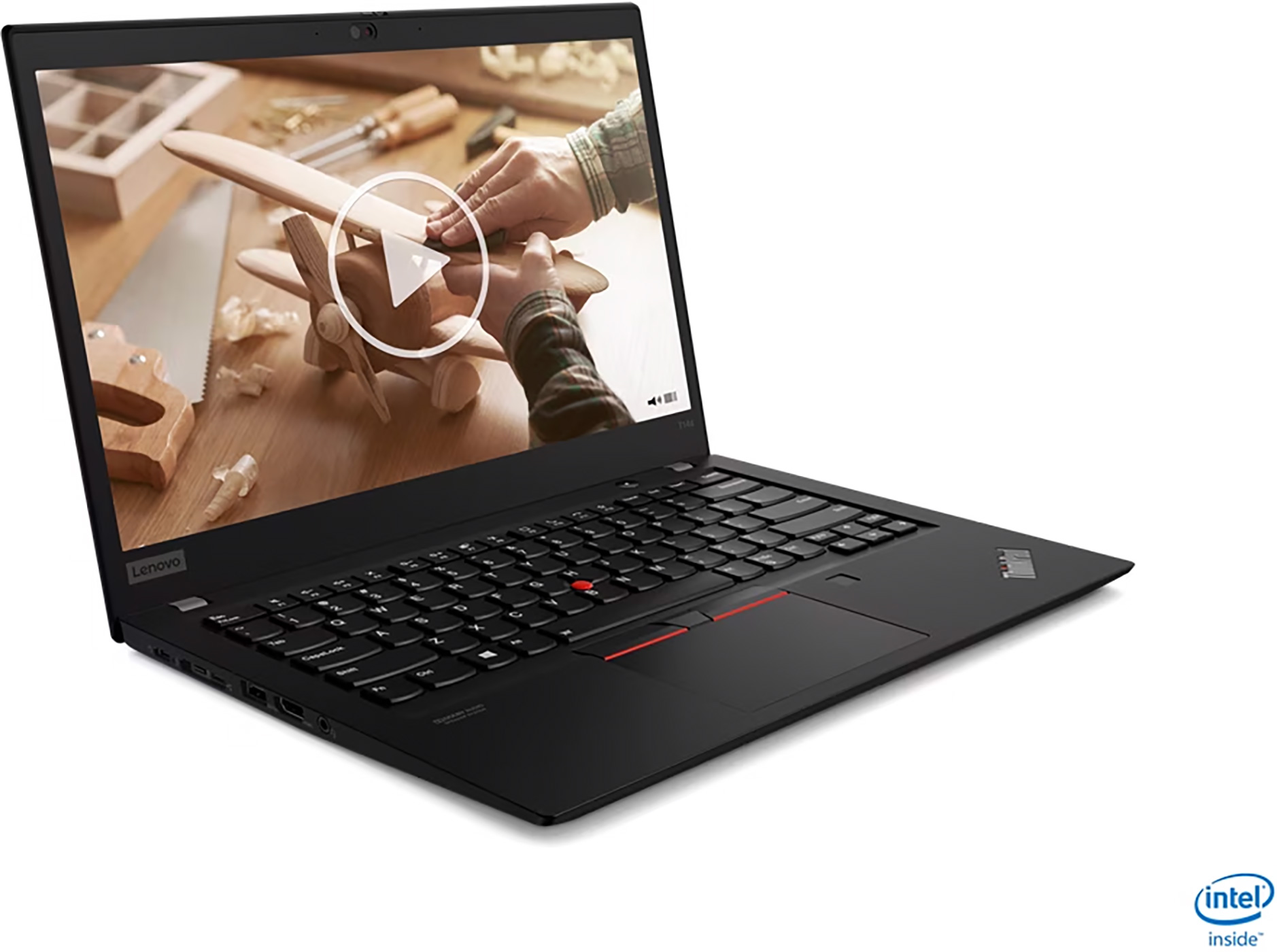 A black laptop with a video playing on the screen. The scene is showing a person working on a wooden airplane.