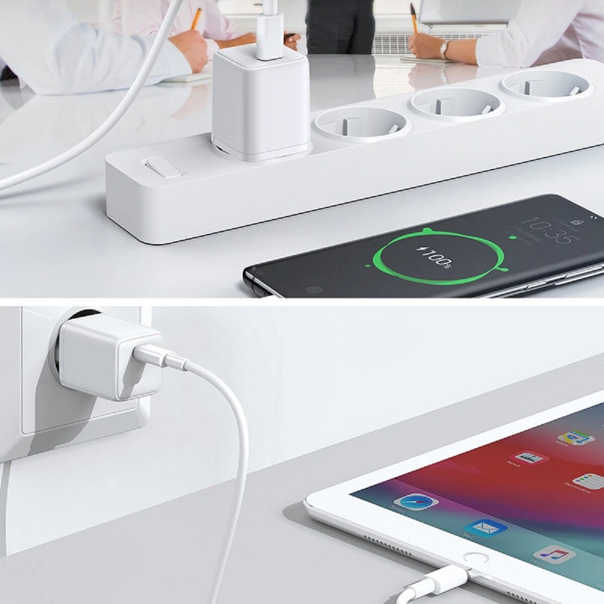 Ein weißes Wandladegerät ist in eine Steckdose gesteckt. In der Nähe werden ein Telefon und ein Tablet aufgeladen.