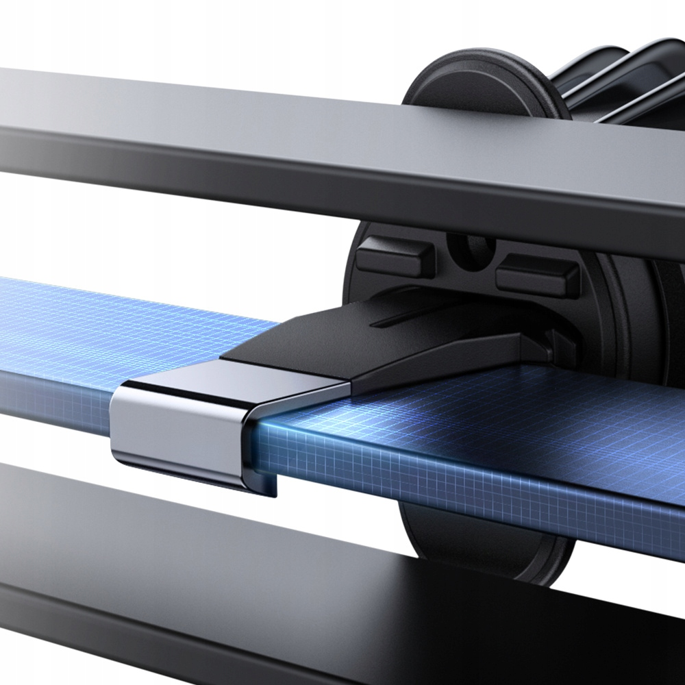 Zbliżenie na czarny uchwyt samochodowy do kratki wentylacyjnej. Uchwyt jest częściowo zdemontowany, ukazując wewnętrzny mechanizm.