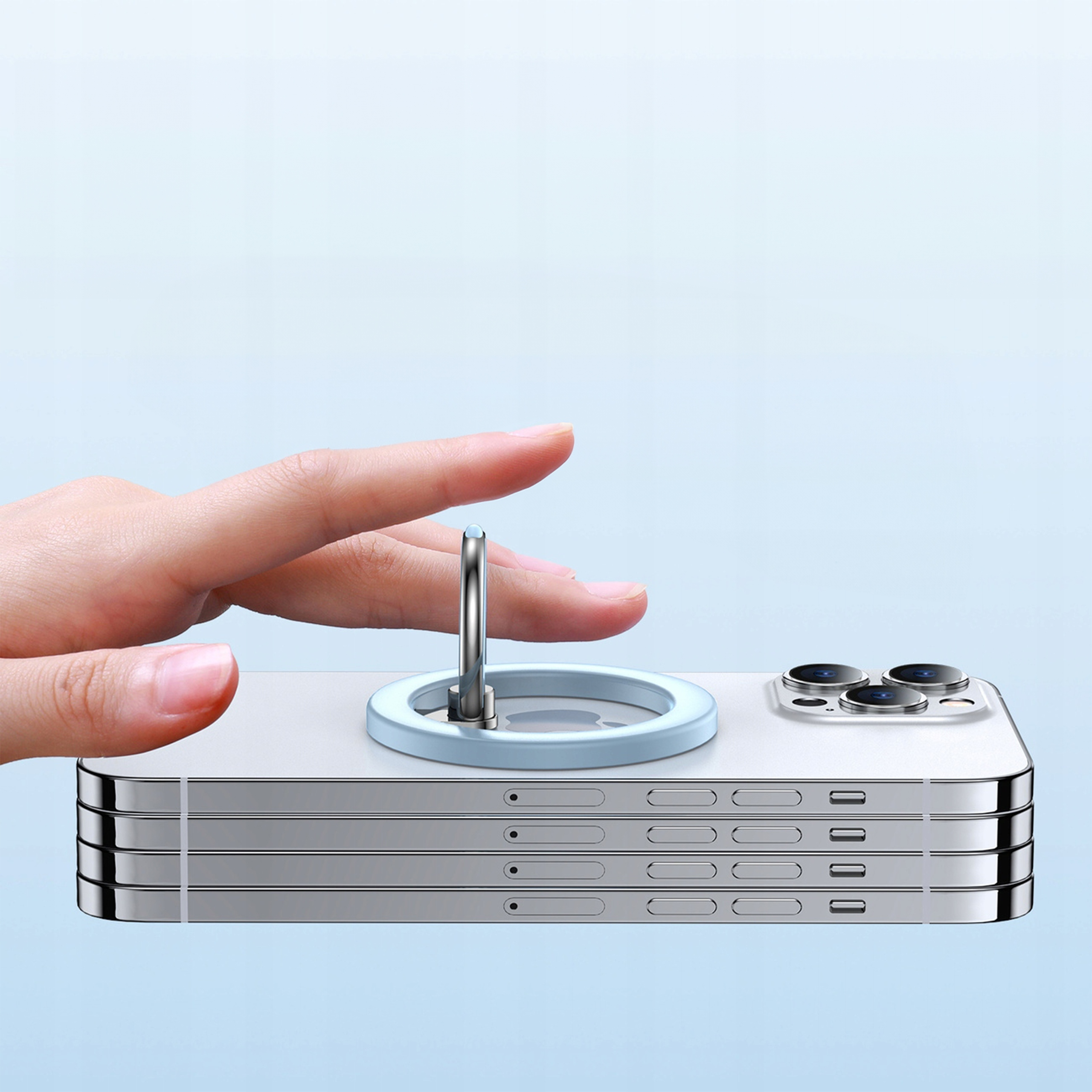 Dłoń dotyka jasno-niebieskiego uchwytu na pierścień przymocowanego do srebrnego iPhone'a.