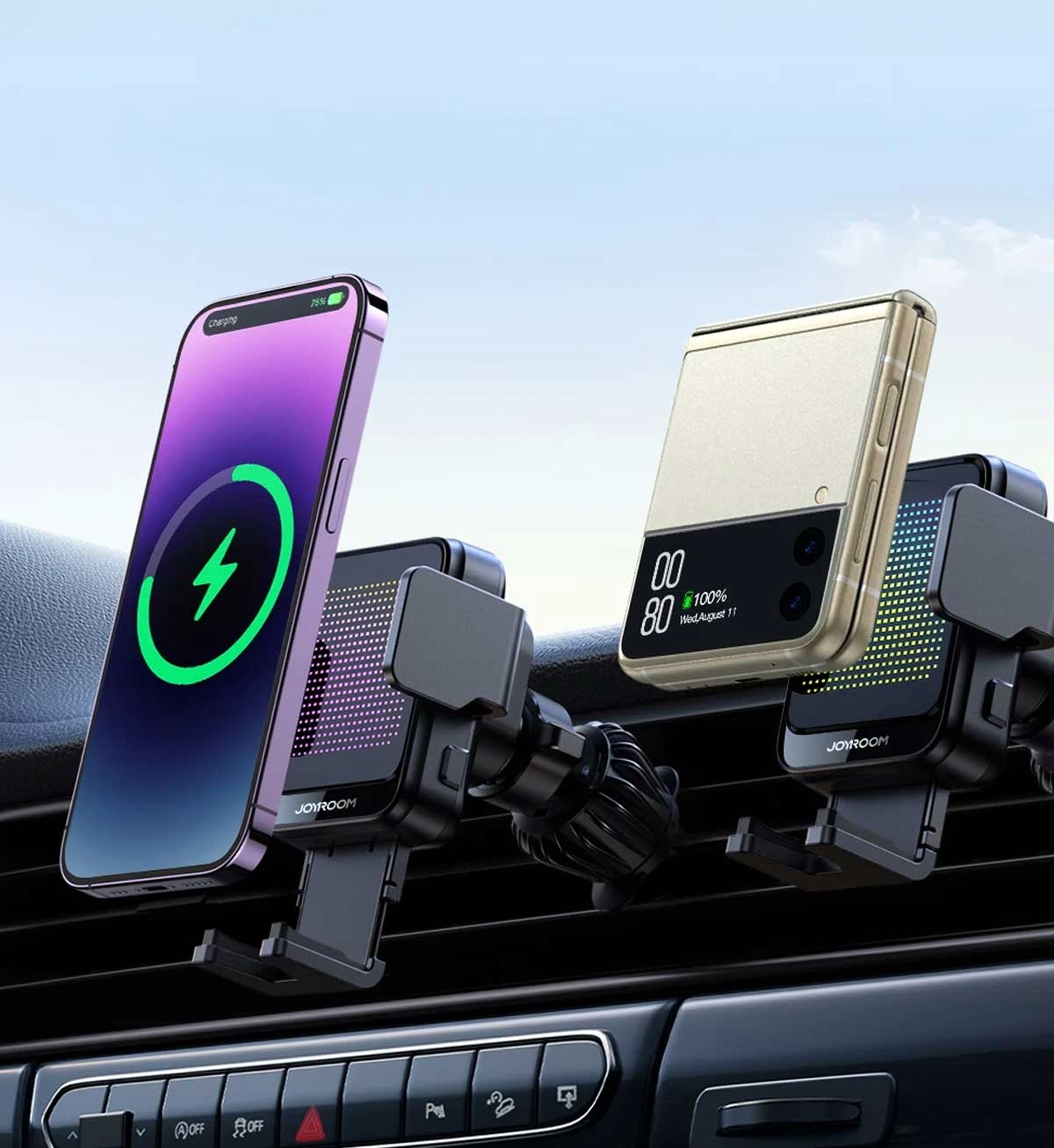 Dwa telefony ładują się w uchwytach samochodowych do telefonu na kratkę wentylacyjną. Jeden to telefon z klapką, drugi to standardowy smartfon.