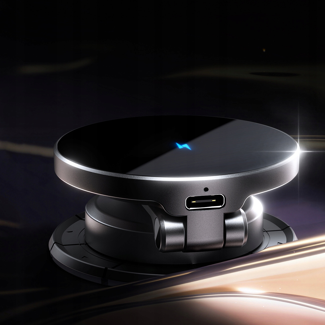 Obraz przedstawia elegancką, czarną bezprzewodową podkładkę ładującą z niebieskim wskaźnikiem świetlnym, prezentującą jej nowoczesny wygląd i funkcjonalność.