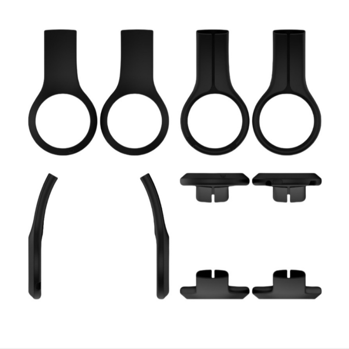 Una collezione di parti di cuffie in plastica nera è organizzata su uno sfondo bianco.