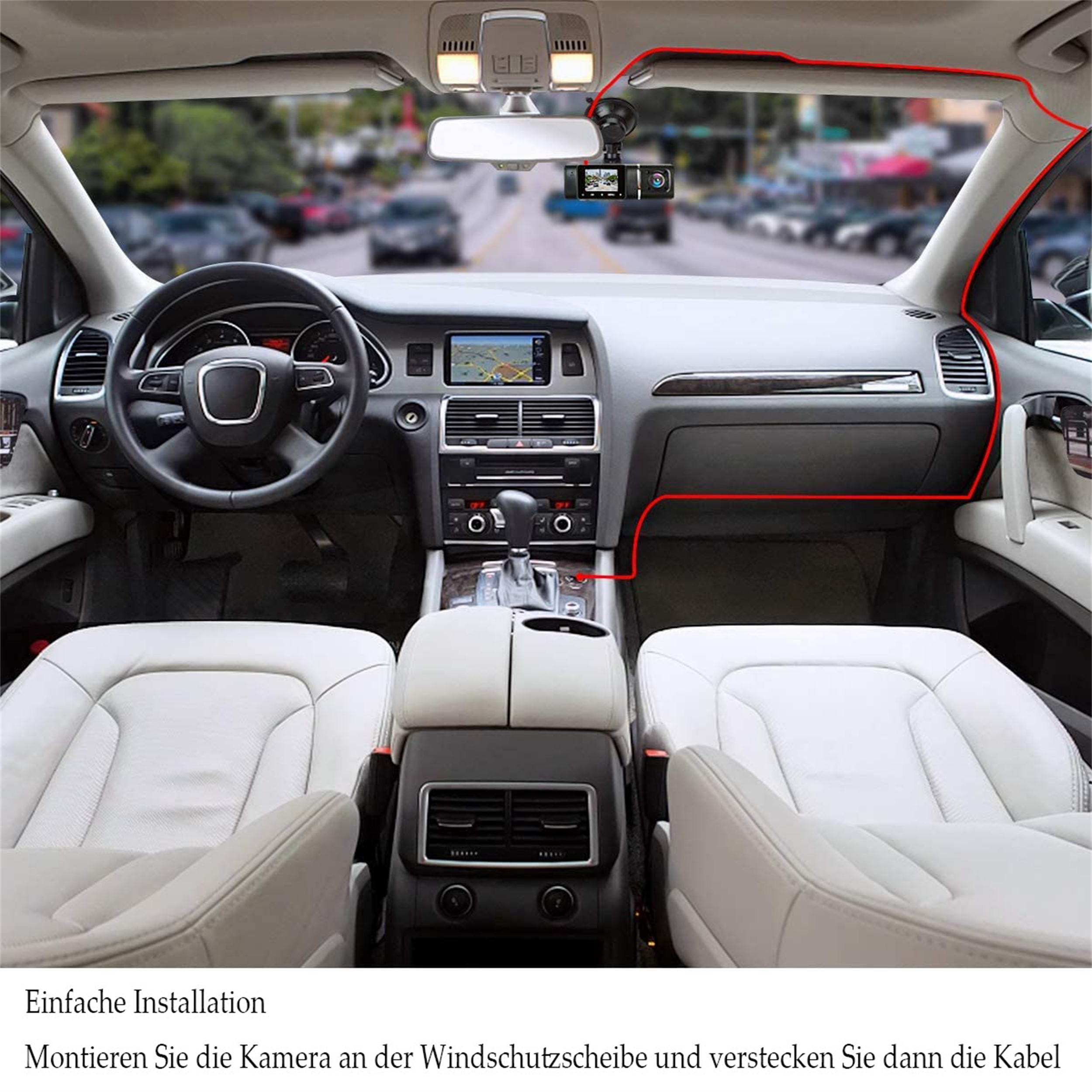 Die Innenansicht des Autos zeigt Armaturenbrett, Sitze und eine an der Windschutzscheibe montierte Kamera, die mit roten Linien hervorgehoben ist.