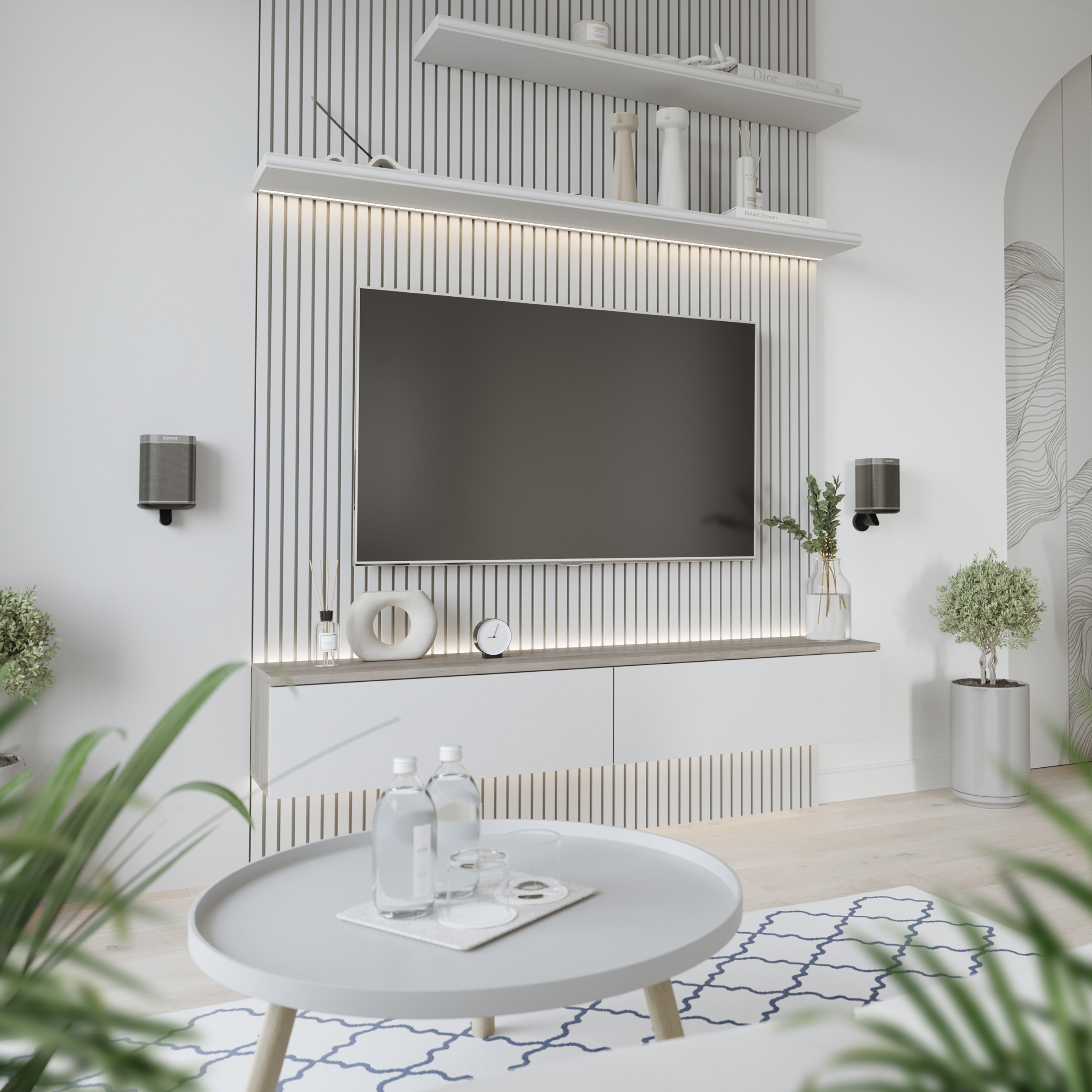 Ein modernes Wohnzimmer verfügt über einen an der Wand montierten Fernseher, Lautsprecher und Zierpflanzen.