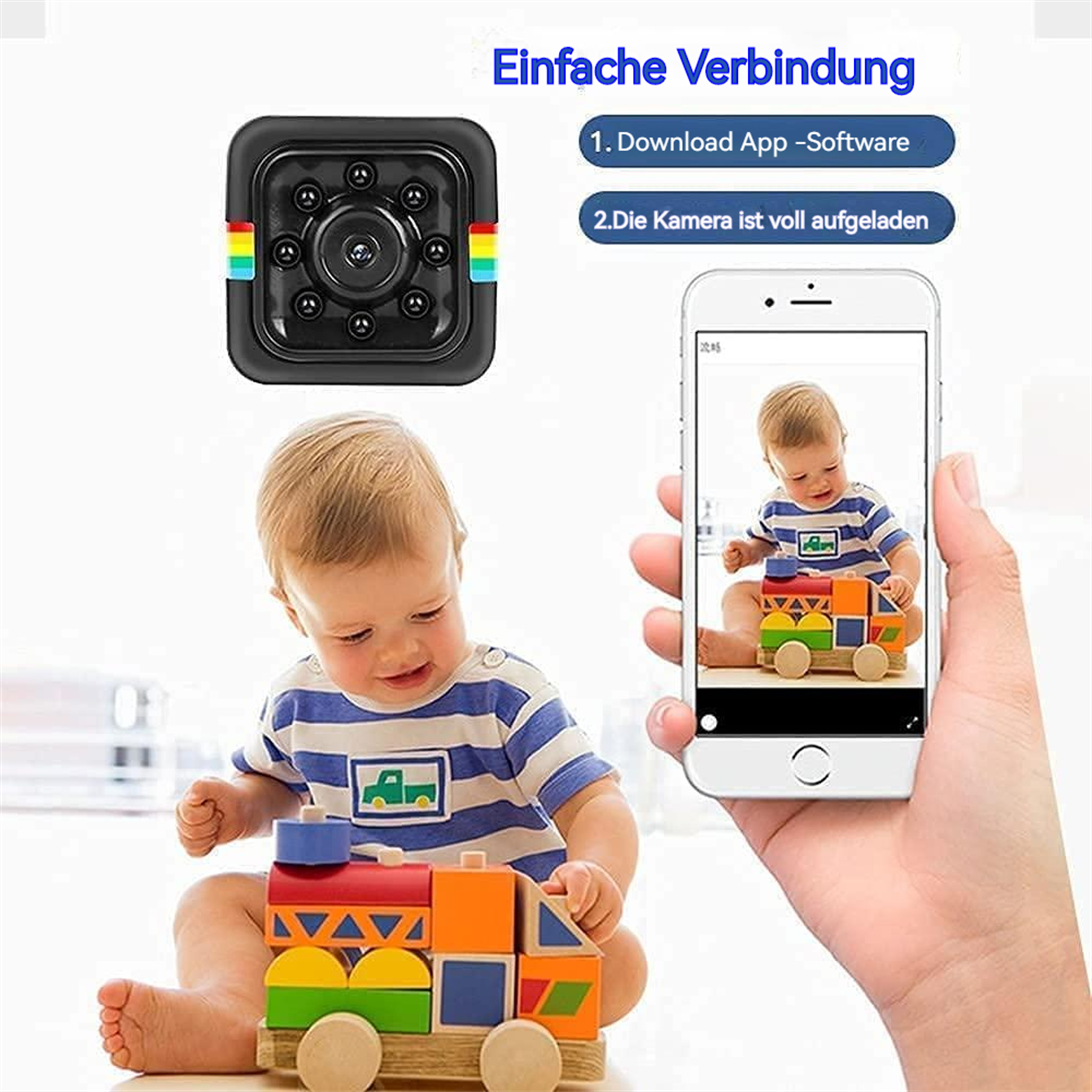 Eine kleine schwarze Würfelkamera und ein Smartphone, das ein Baby zeigt, das mit Bauklötzen spielt.