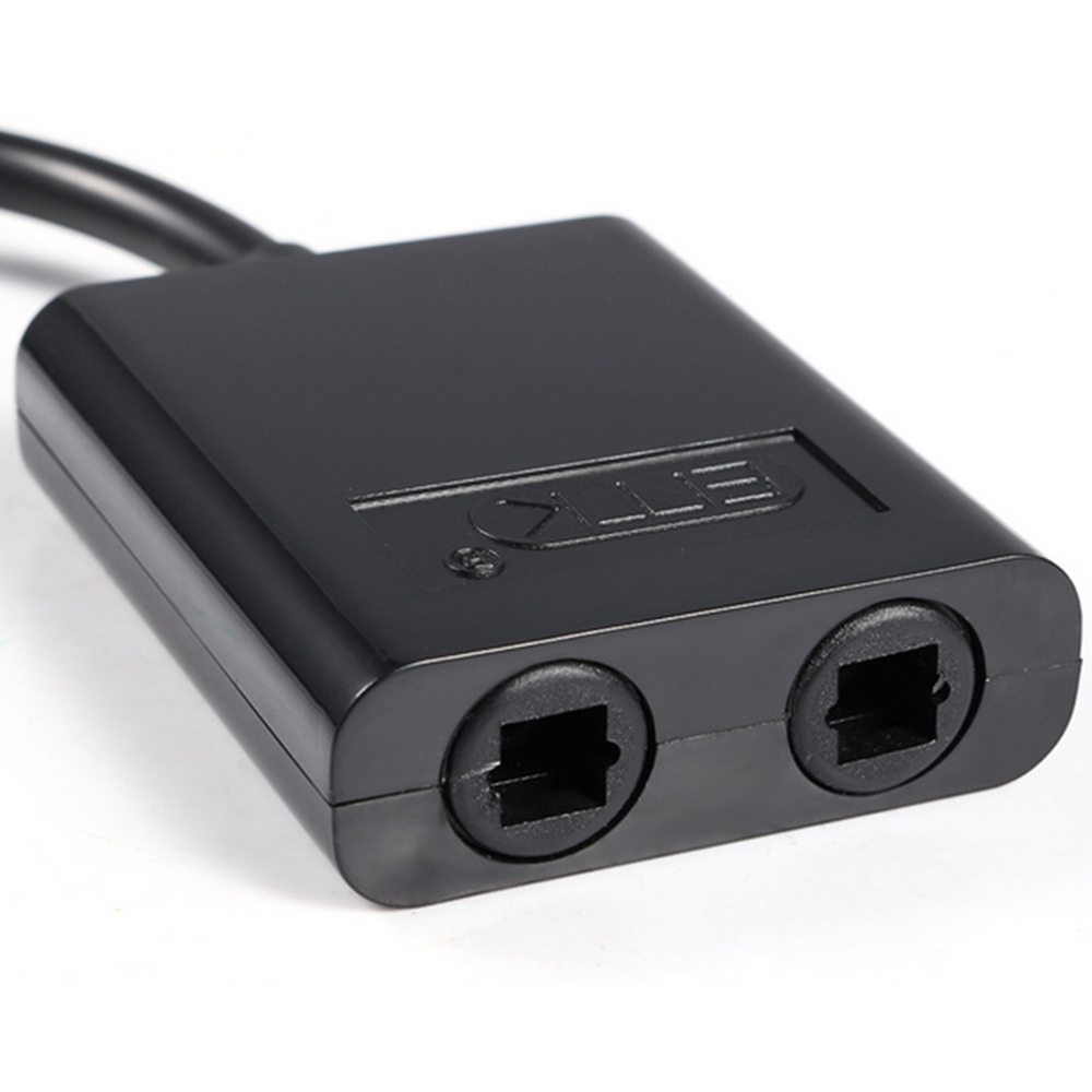 Schwarzer Glasfaserkoppler mit zwei quadratischen Anschlüssen und einem Kabel.