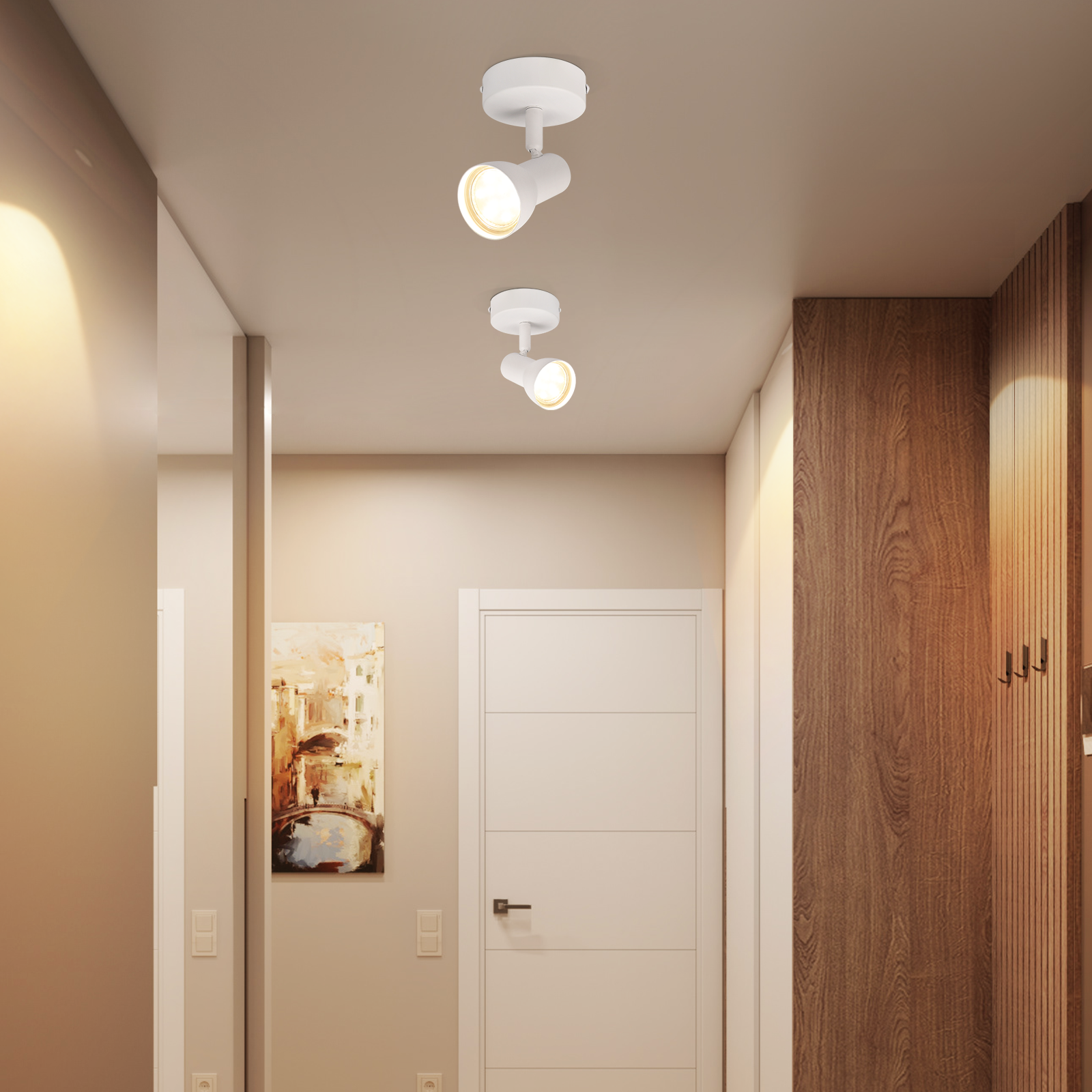 Przedpokój z reflektorami, białymi drzwiami i obrazem, tworzący nowoczesny widok wnętrza.