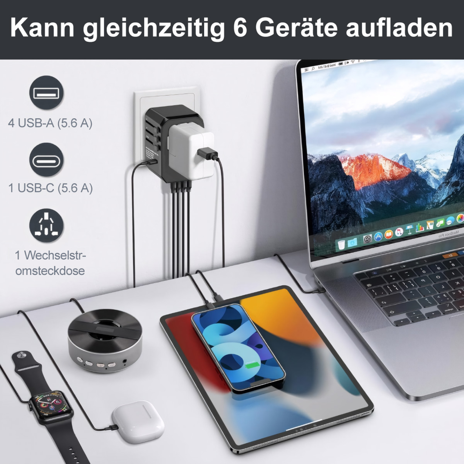 Ein schwarzer Adapter lädt sechs Geräte gleichzeitig auf, darunter ein Laptop, ein Tablet und ein Telefon.