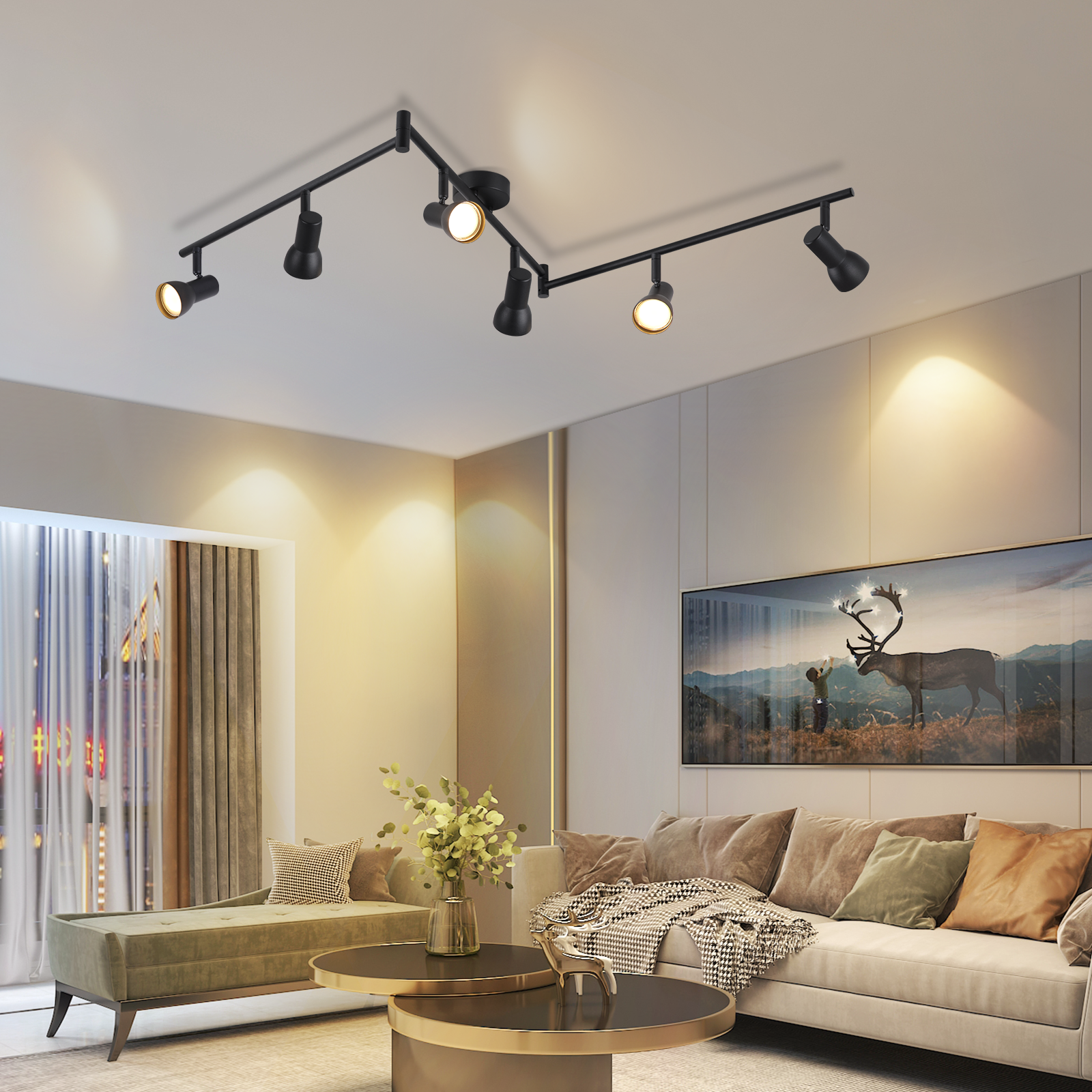 Salon z systemem oświetlenia szynowego na suficie. Zawiera kanapę, sztukę i elementy dekoracyjne.