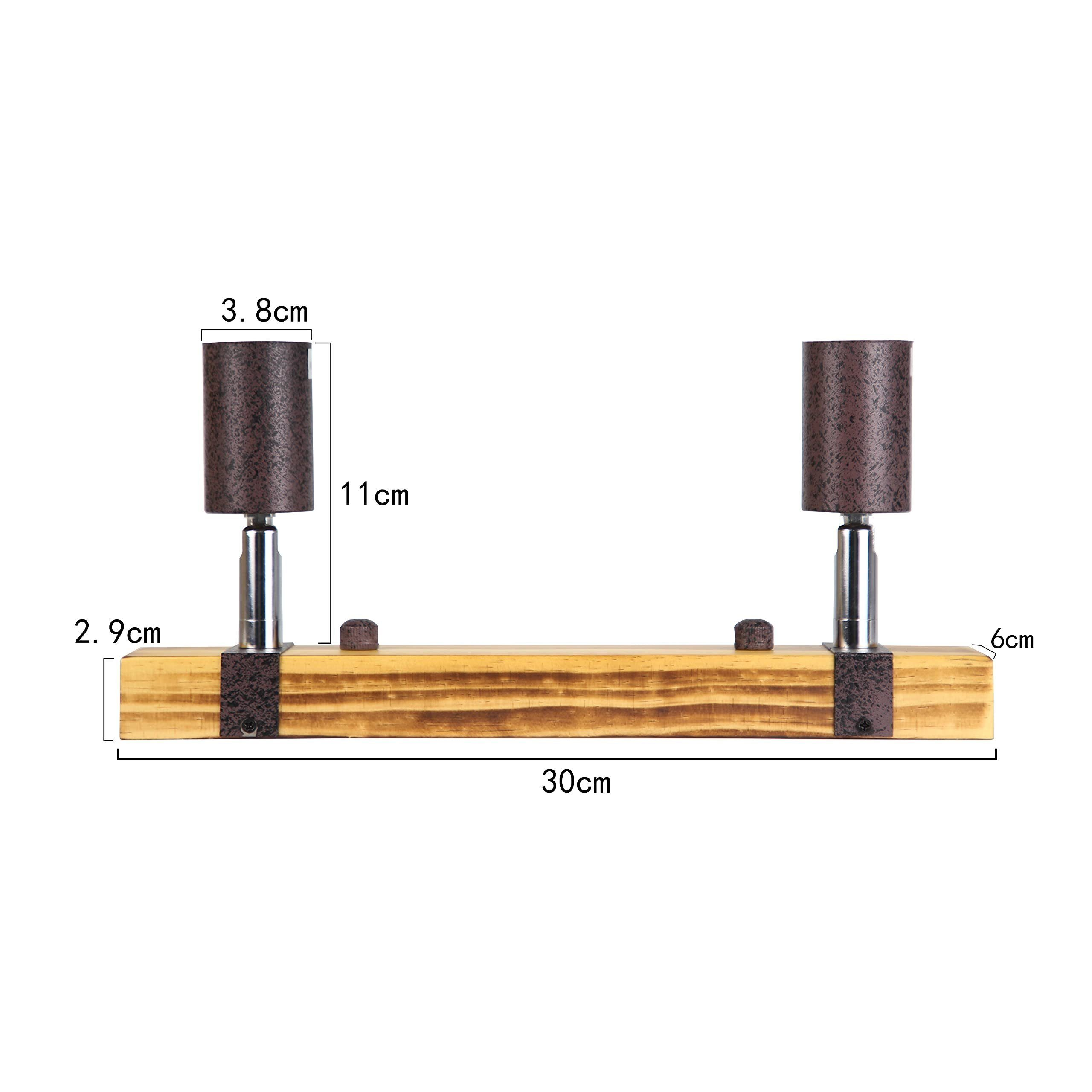 Zwei braune Scheinwerfer sind symmetrisch auf einem Holzbalken montiert, Abmessungen in cm beschriftet.