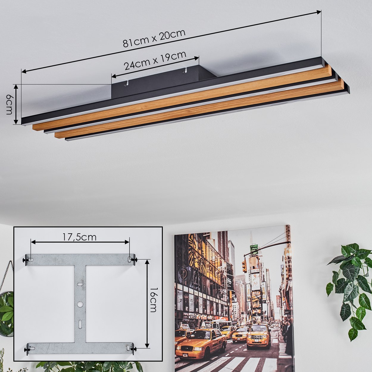 Eine moderne Deckenleuchte mit Abmessungen in einem Raum mit einem Gemälde von New York City.