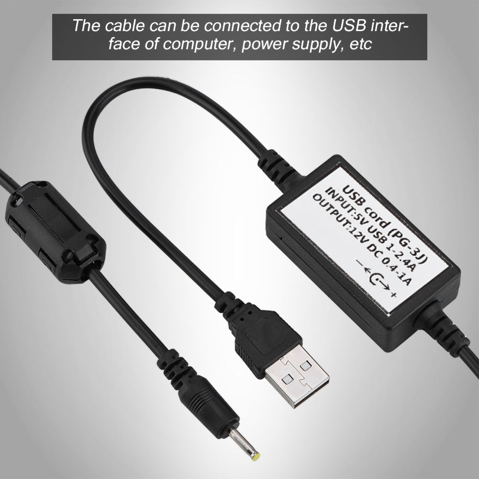 Das Bild zeigt ein USB-Ladekabel mit einem schwarzen Kabel und einem rechteckigen Modul mit Eingangs-/Ausgangsspezifikationen.