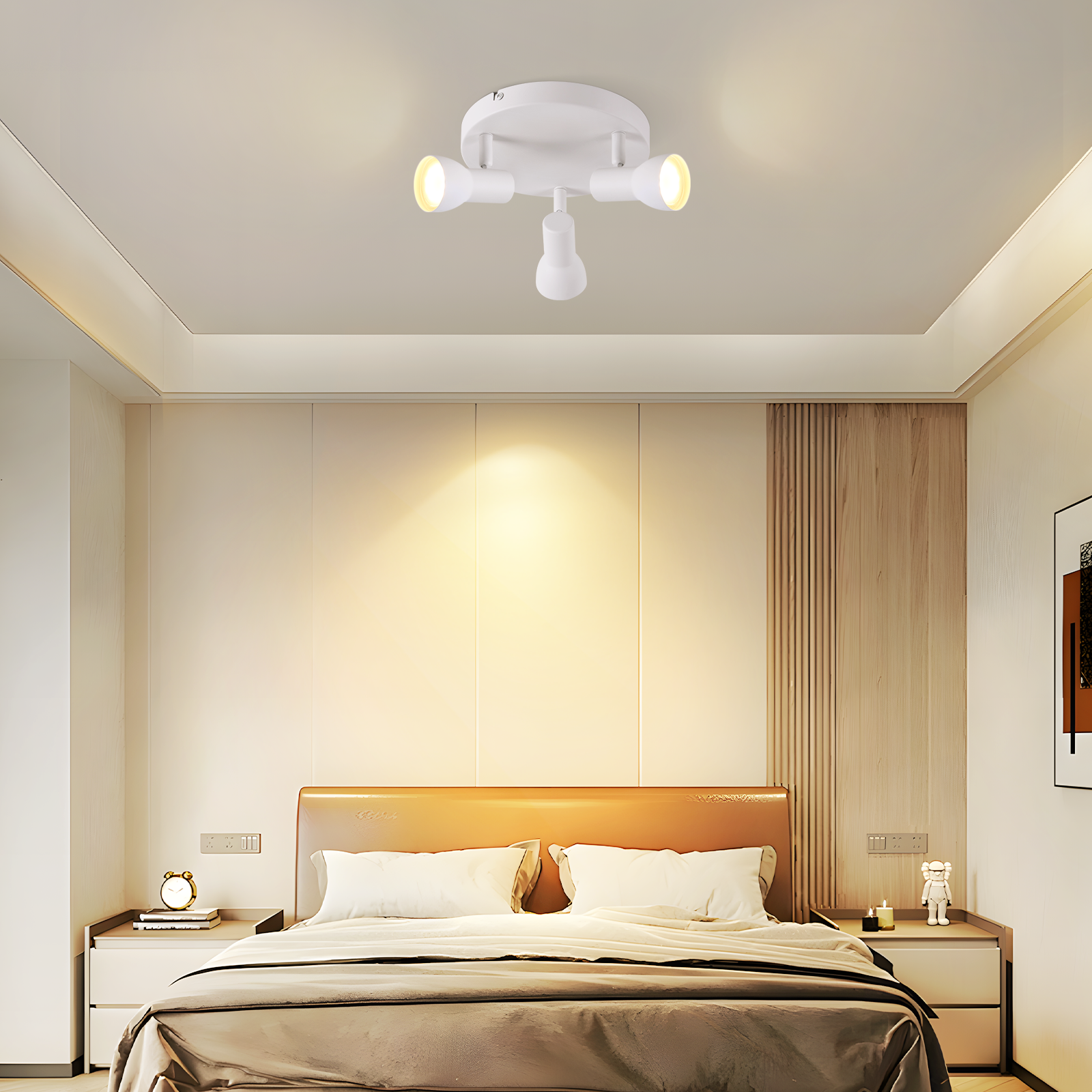 Biały reflektor sufitowy z trzema światłami zainstalowany w sypialni.