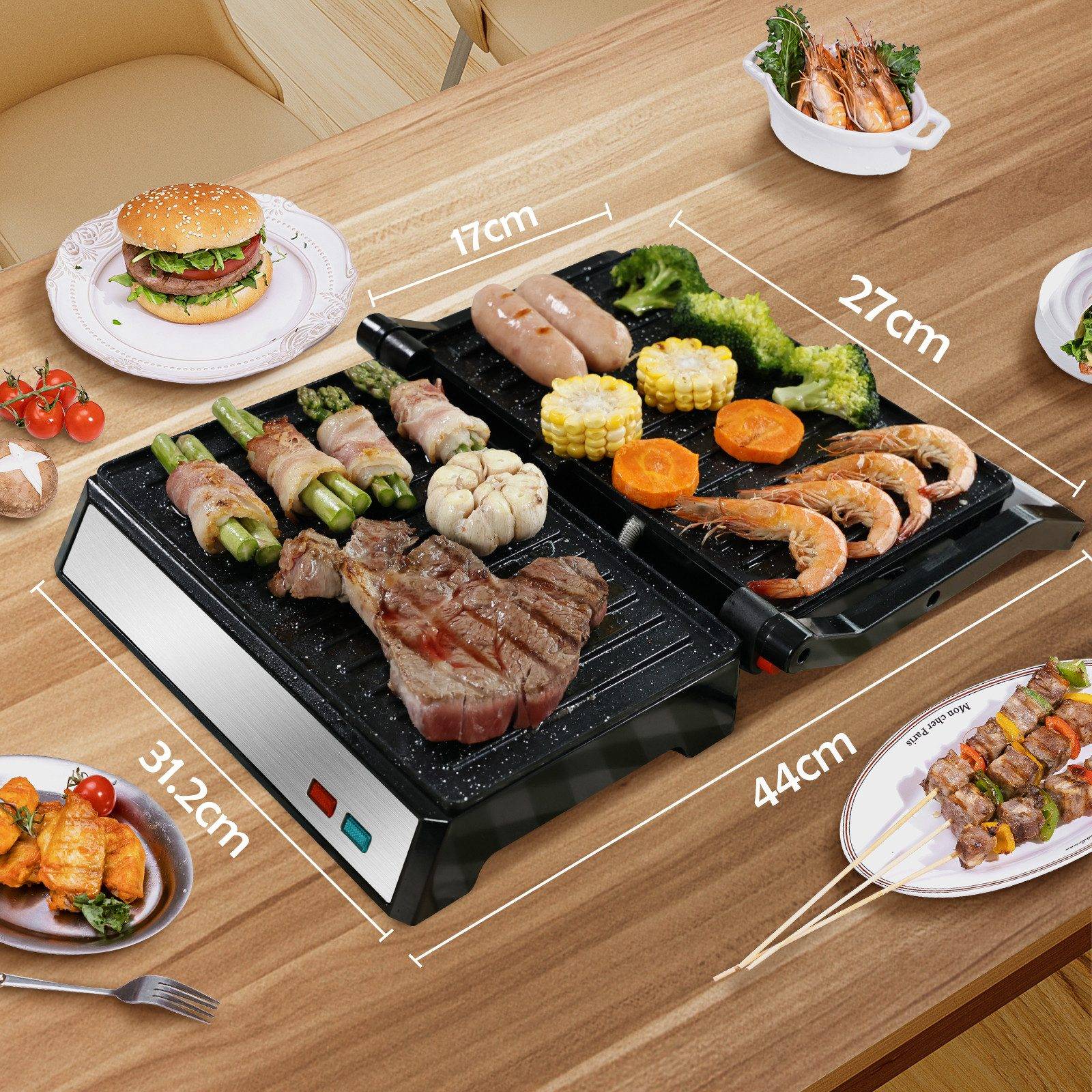 Ein Tisch mit Grill und verschiedenen gekochten Speisen. Maße sind auf dem Grill angezeigt.