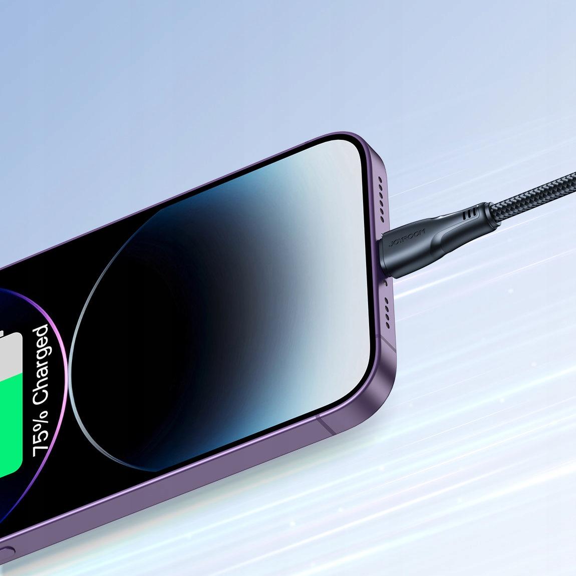 Fioletowy iPhone ładujący się za pomocą czarnego kabla, wskazujący naładowanie baterii w 75%.