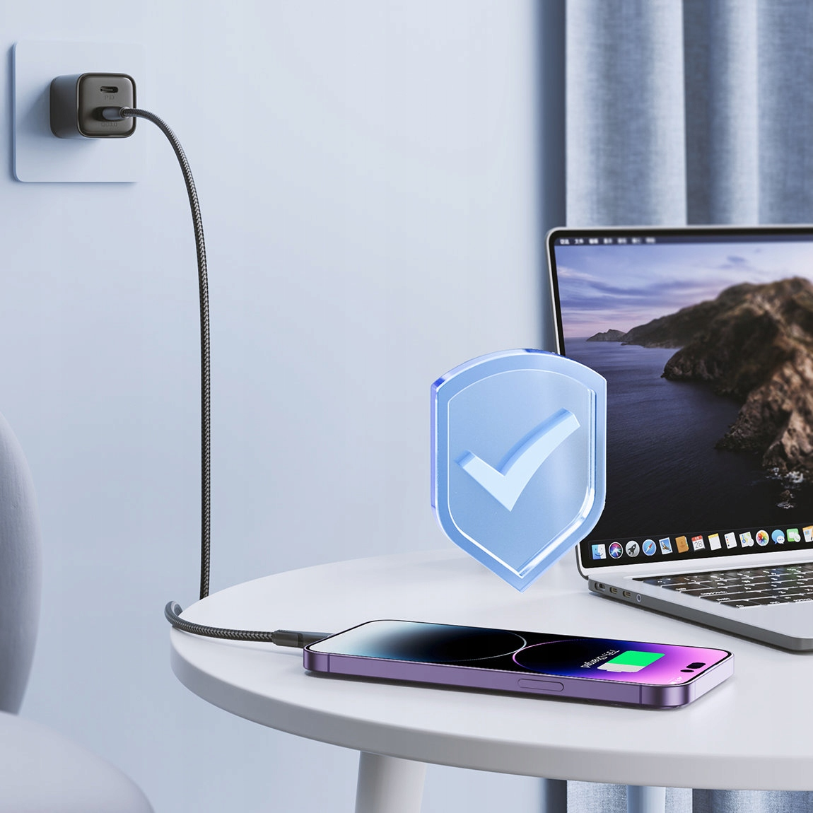 Fioletowy iPhone ładuje się na białym stole z laptopem i grafiką ze znacznikiem wyboru.