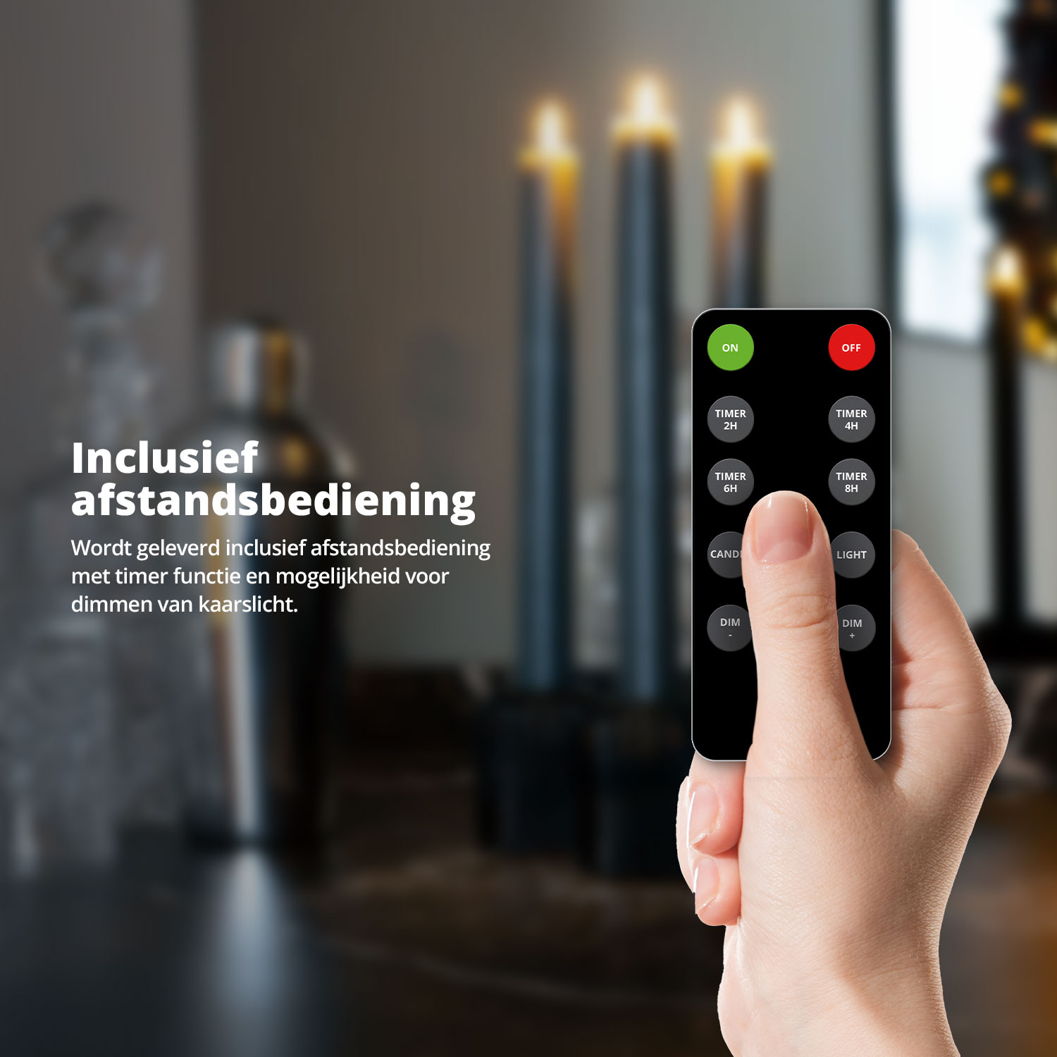A hand holds a remote control with candles burning in the background.