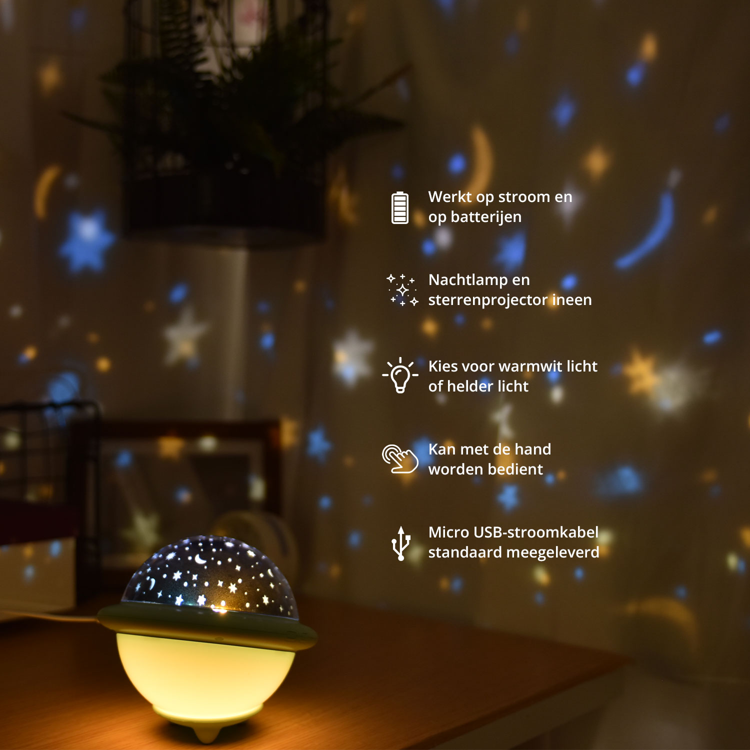 Een nachtlampje projecteert sterren op de muur erachter.
