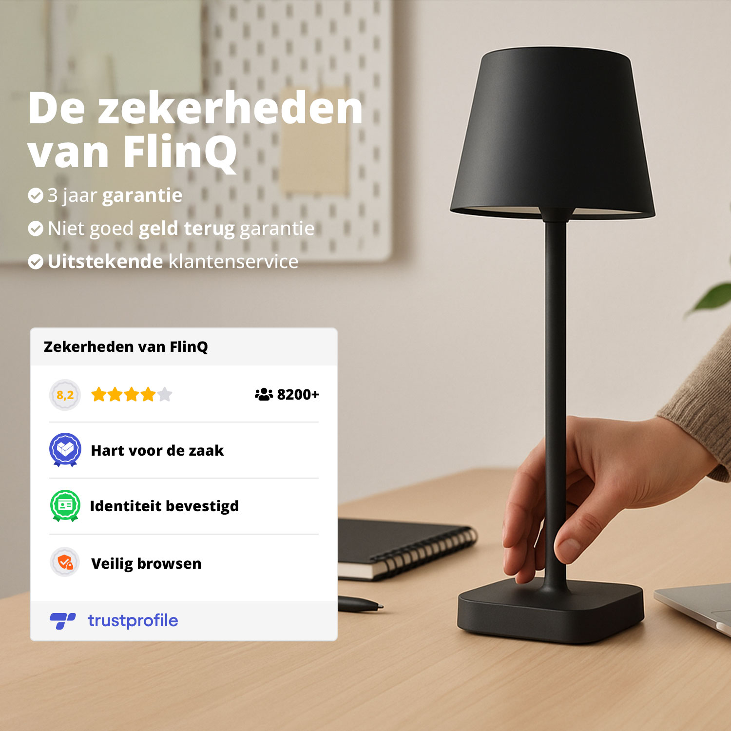 A black table lamp stands on a desk with a hand reaching towards it, with text about the lamp's guarantees.