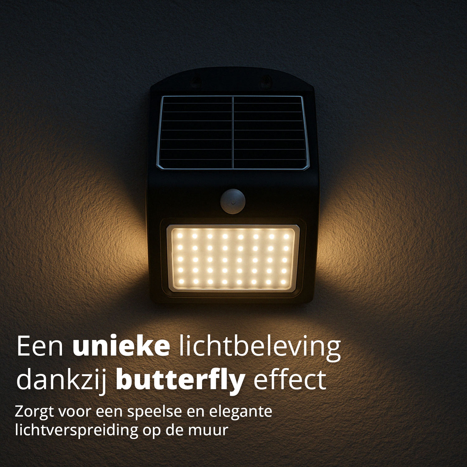 A solar light is mounted on a gray wall, casting a butterfly effect light pattern.