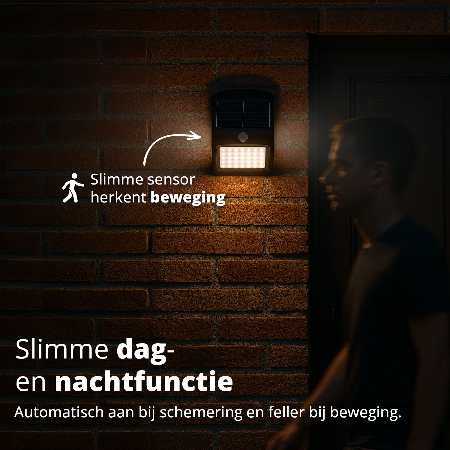A solar light illuminates a brick wall as a person walks by at night.