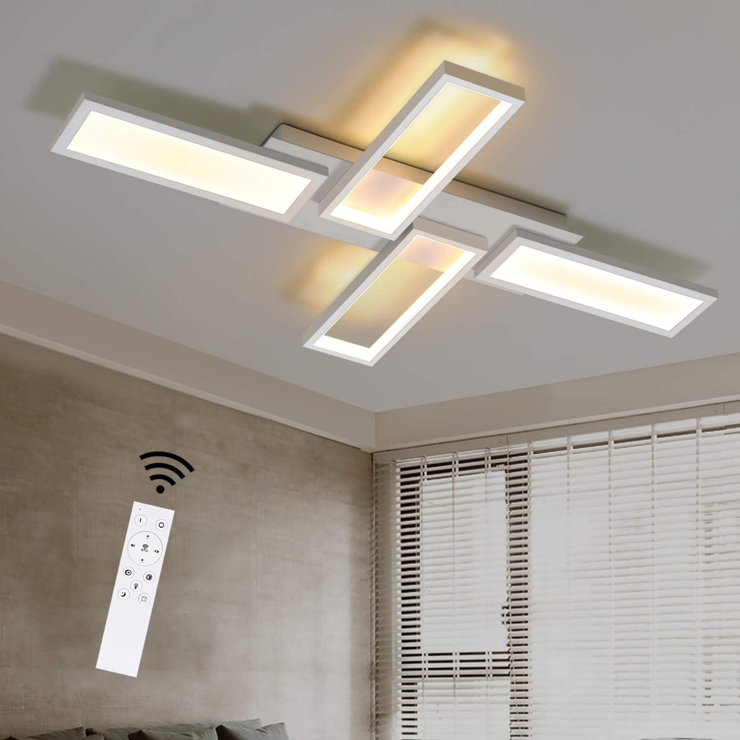 Lampada da soffitto con pannelli intersecanti, che emette luce. Presente anche un telecomando.