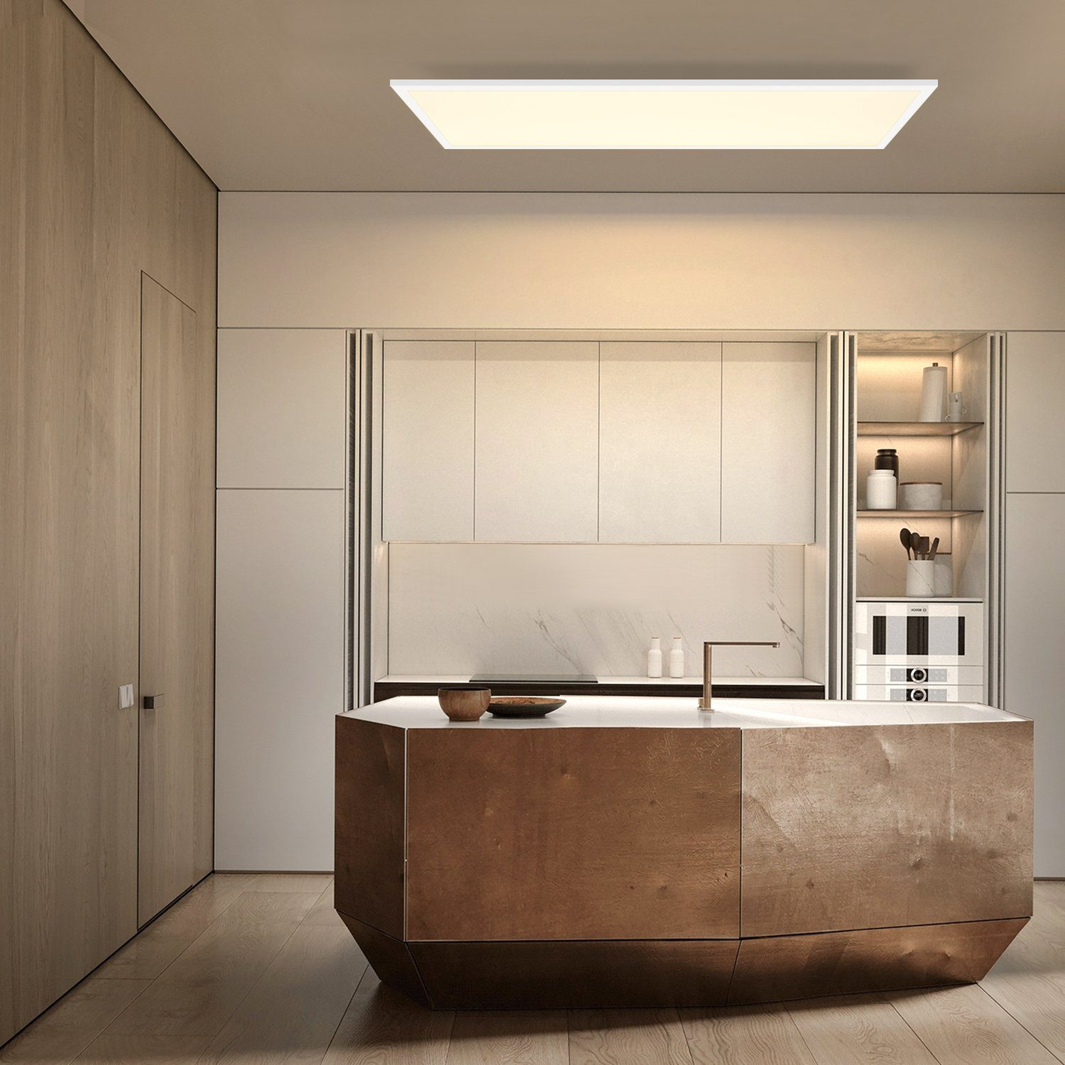 Una cucina con un'isola in legno, ripiani in marmo e una plafoniera a LED.