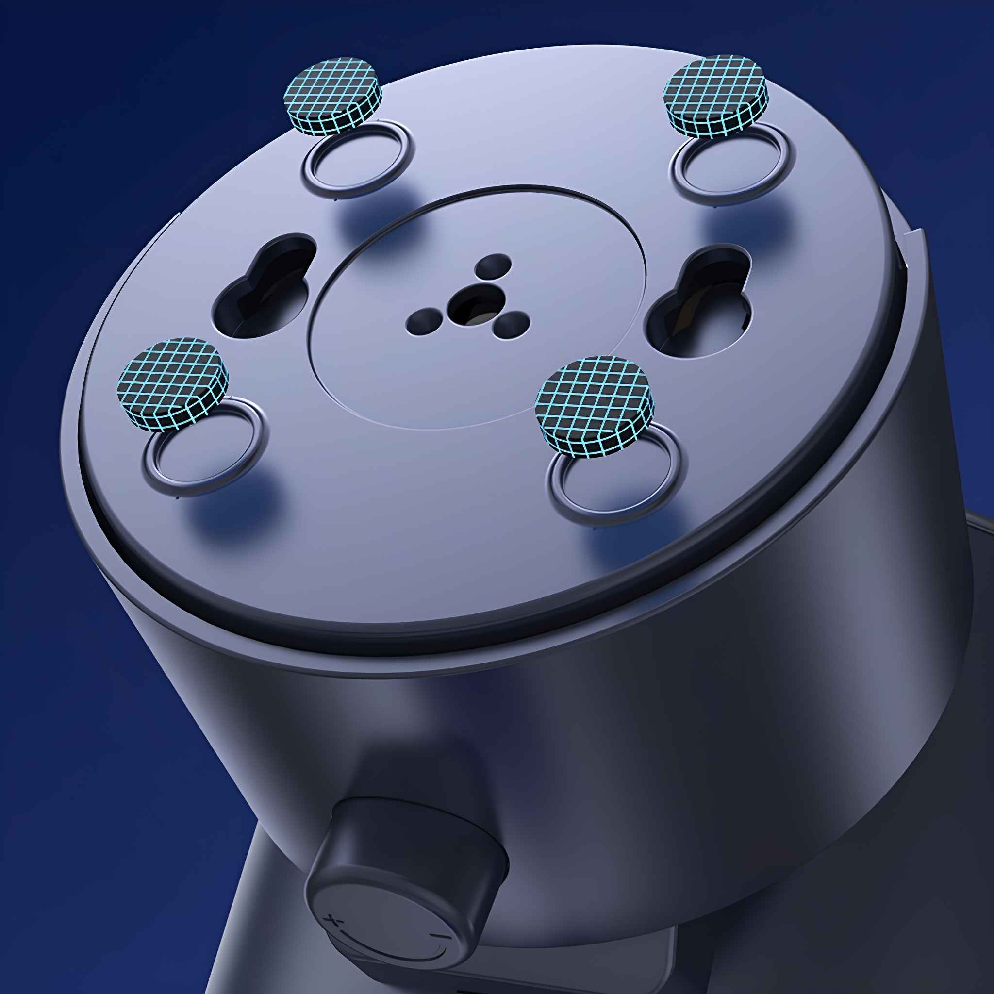 Eine Nahaufnahme der Unterseite eines Ventilators, die die Gummifüße und einen Bedienknopf vor blauem Hintergrund zeigt.