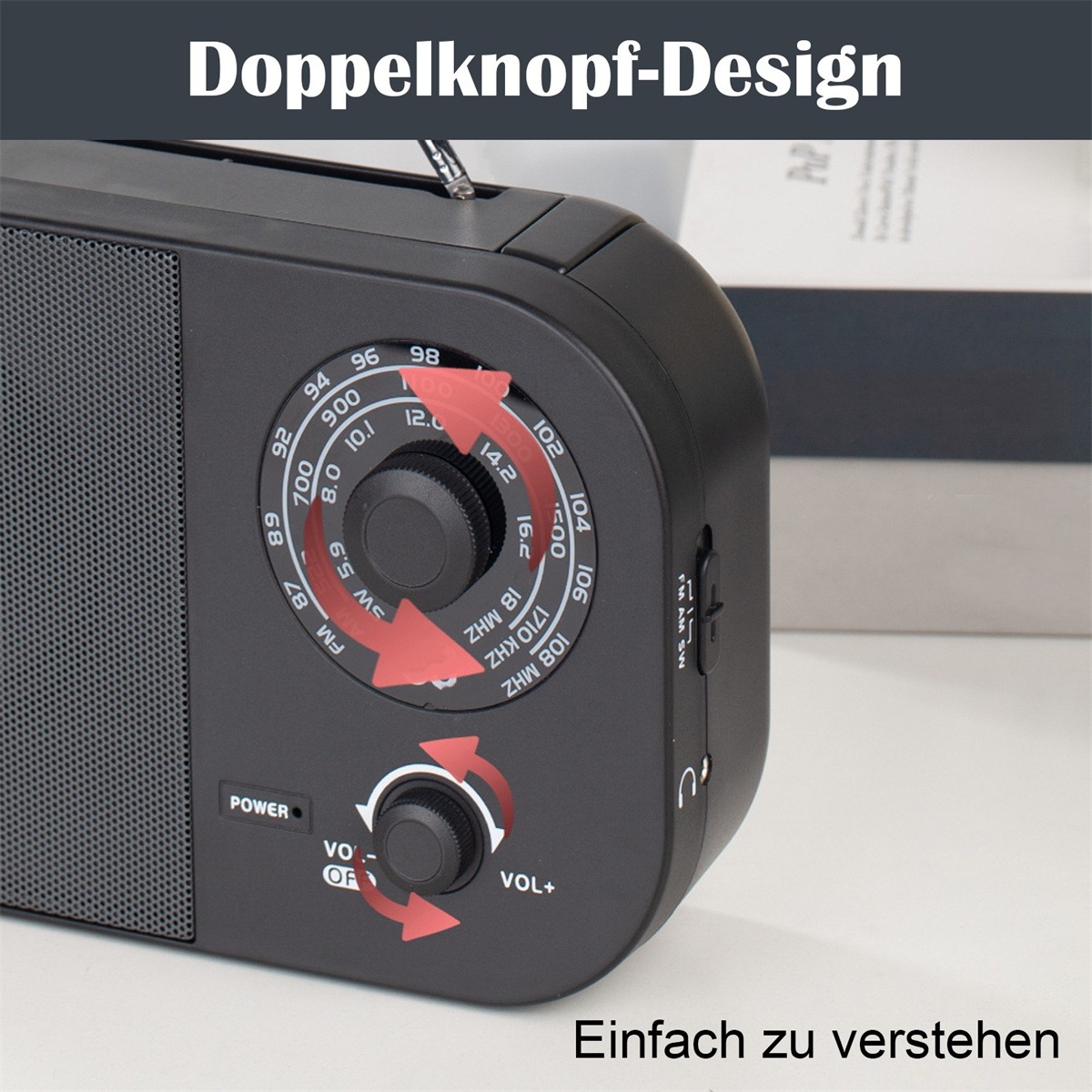 Ein schwarzes Radio mit einem Dual-Knopf-Design zur Abstimmung und Lautstärkeregelung, zur einfachen Verständlichkeit beschriftet.