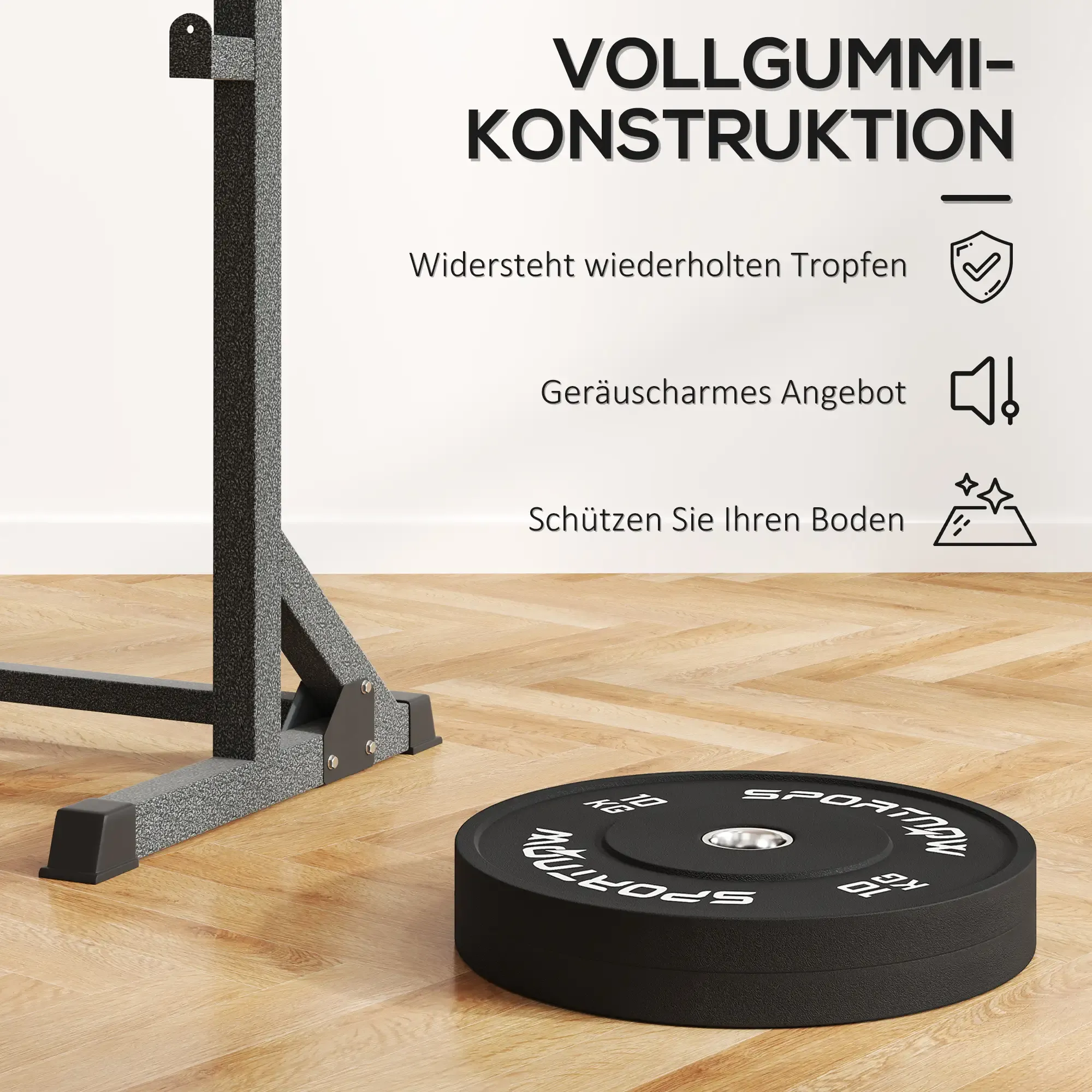 Eine schwarze 10-kg-Gewichtsscheibe auf einem Holzboden neben Fitnessgeräten.
