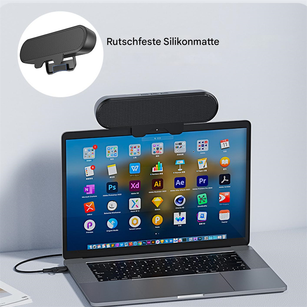 Eine schwarze Soundbar ist an der Oberseite eines Laptop-Bildschirms befestigt, wobei App-Symbole auf dem Display sichtbar sind.