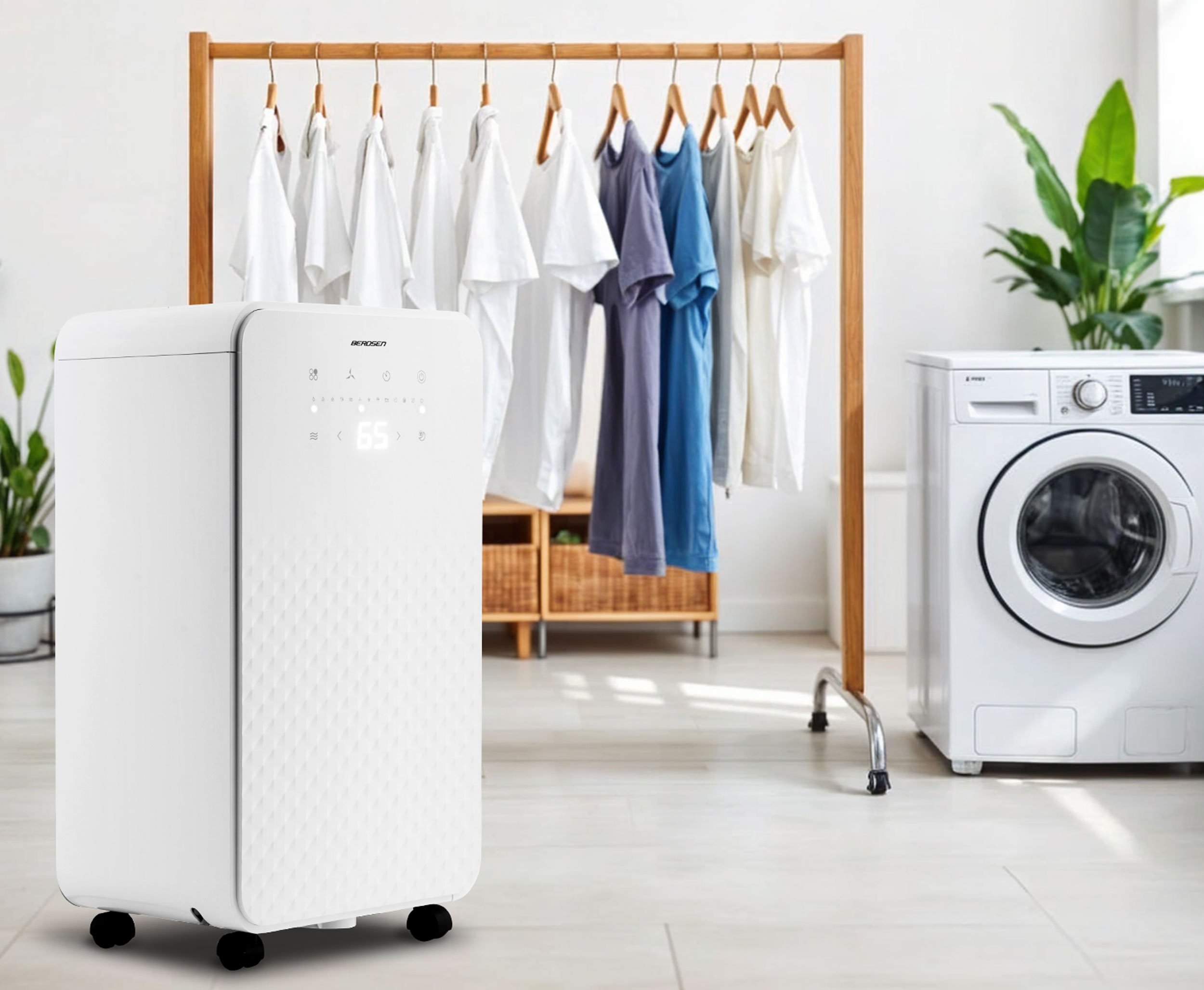 Biały osuszacz powietrza w pralni, obok pralki i suszarki na ubrania.