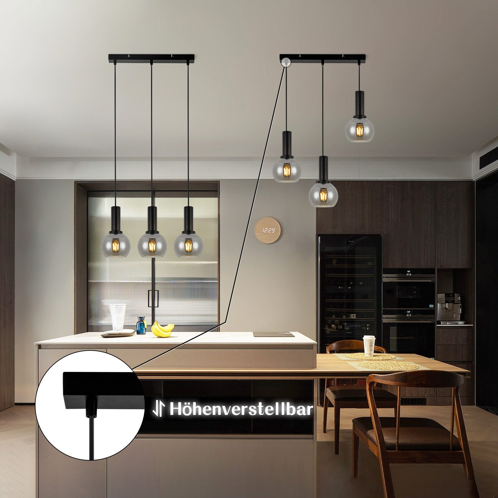 Cucina con tre lampade a sospensione appese sopra un'isola. L'altezza delle luci può essere regolata.