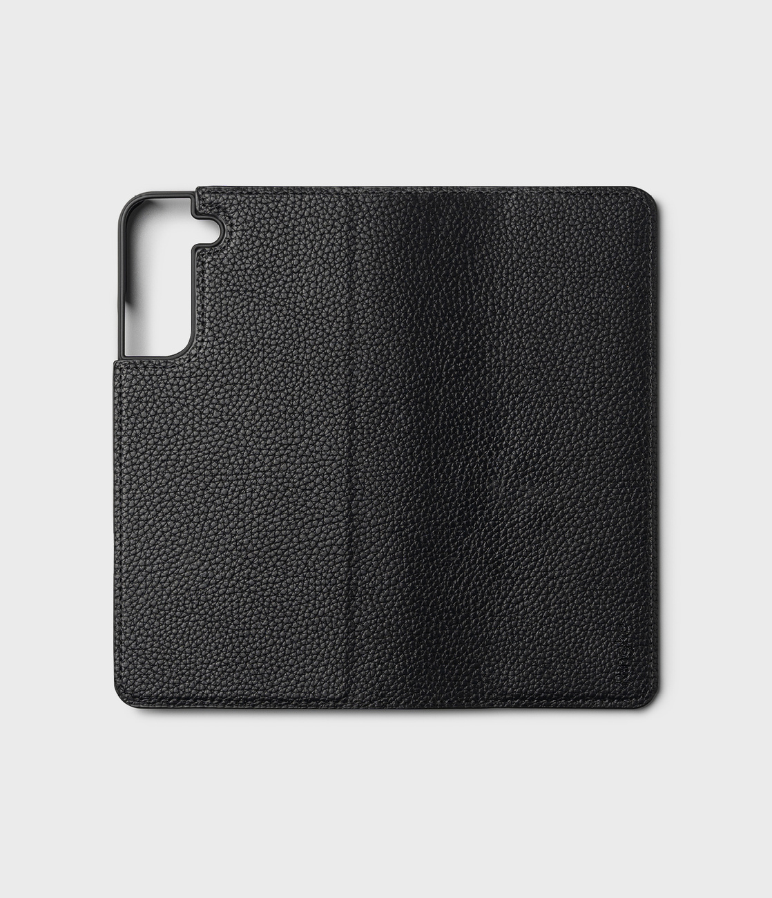 Czarne skórzane etui na telefon z teksturowanym wykończeniem. Minimalistyczny design dla ochrony.