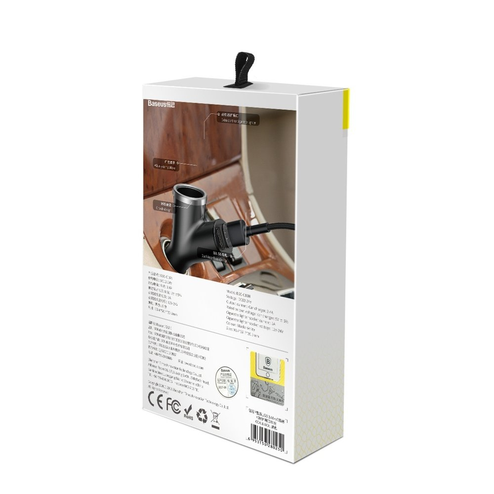 Białe i żółte pudełko z czarną ładowarką samochodową w środku. Tekst i obrazy są wydrukowane na pudełku.