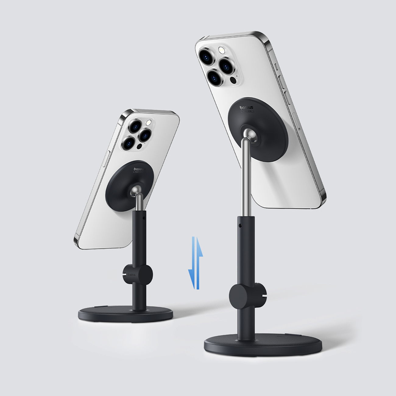 Dwa teleskopowe wały podporowe Baseus MagPro trzymające telefony. Jeden jest wysunięty, drugi nie.