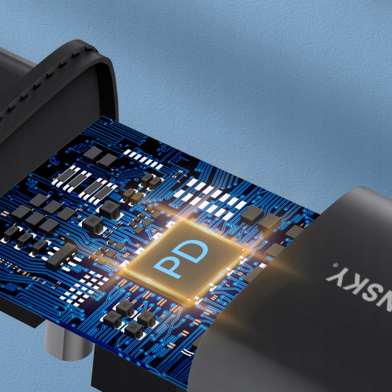 Zbliżenie ładowarki, pokazujące wewnętrzną płytkę obwodu ze symbolem 'PD'.