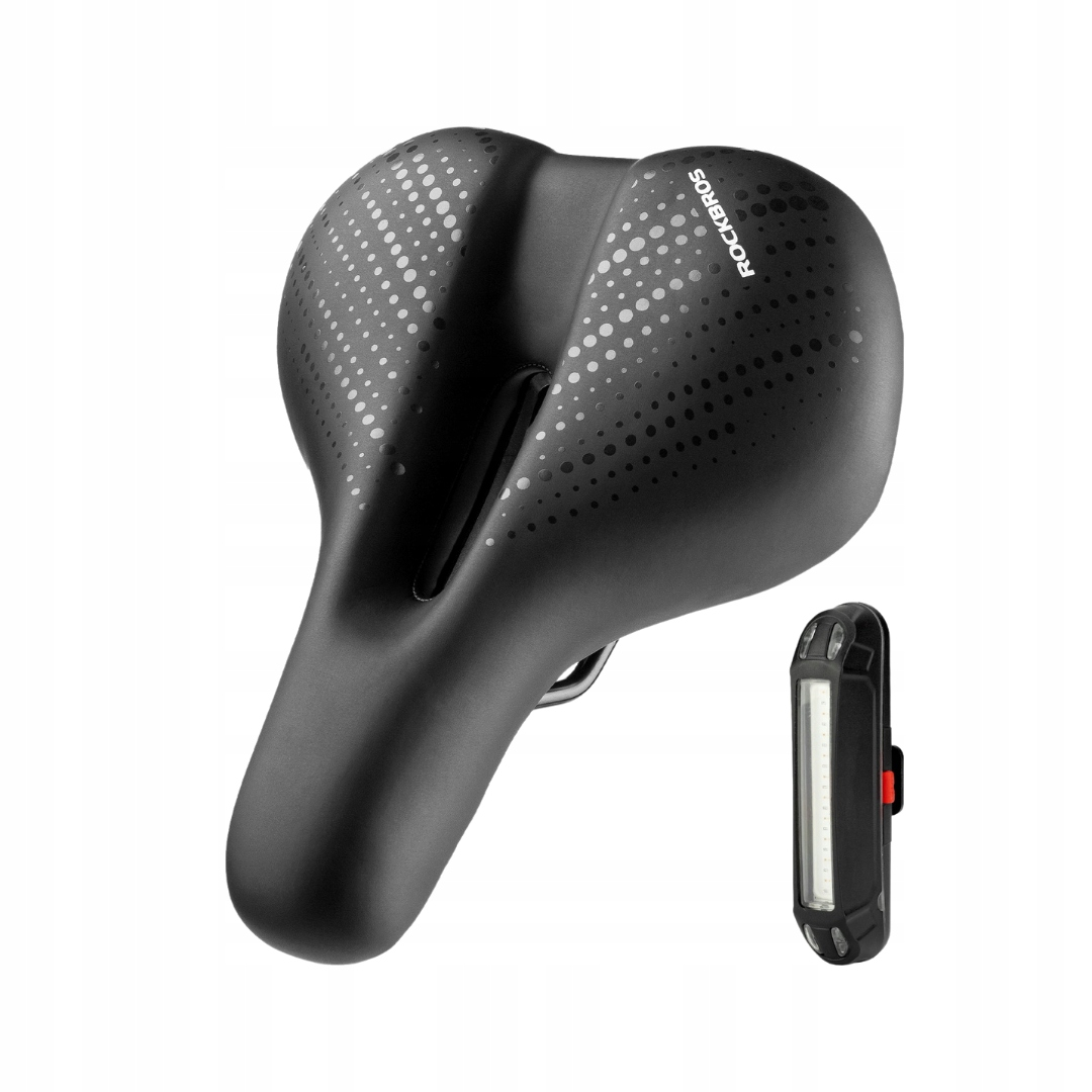 Czarne siodełko rowerowe ze światłem i kropkowym wzorem. Światło jest po prawej stronie.