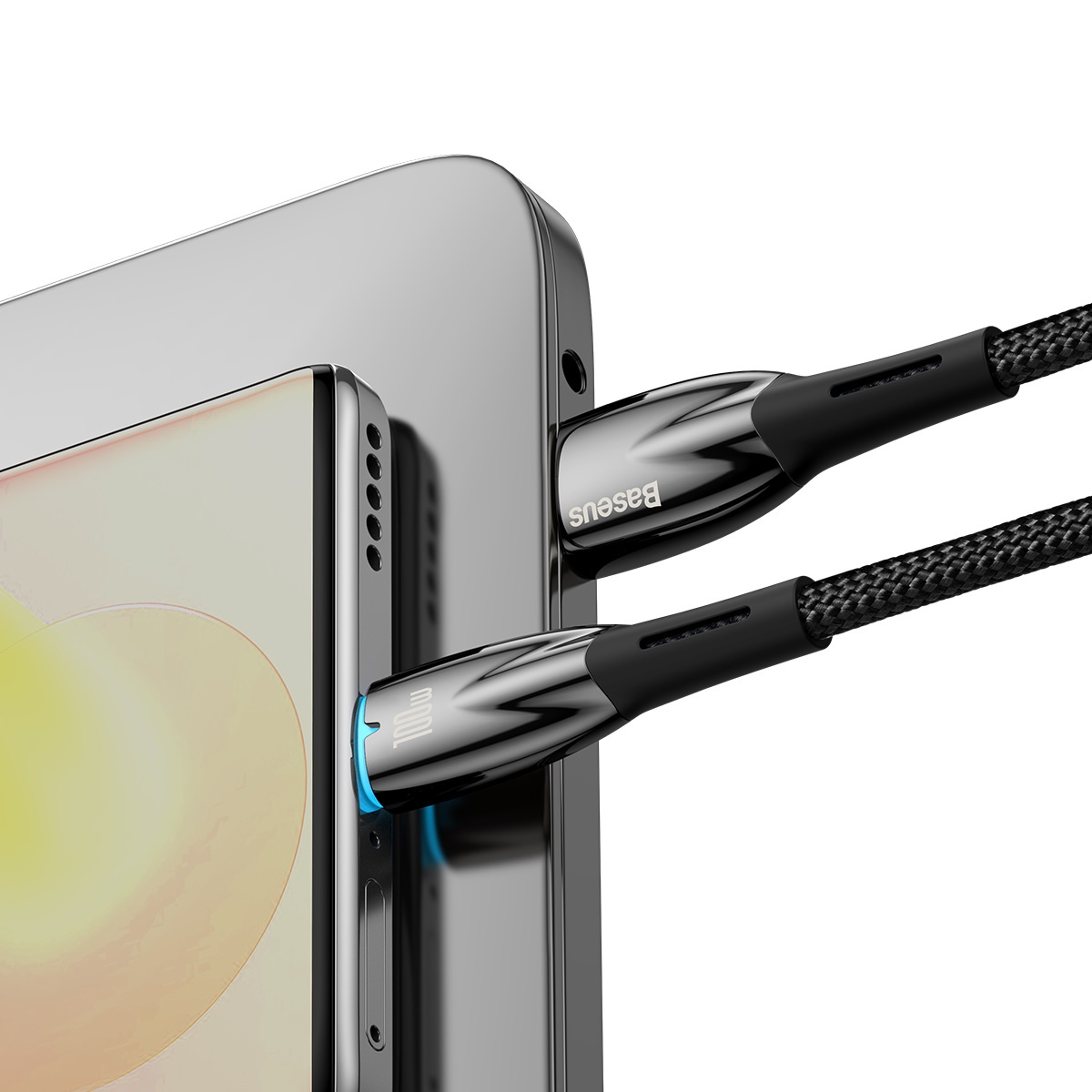 Zbliżenie na telefon ładujący się za pomocą kabla USB-C z czarnym, plecionym przewodem.