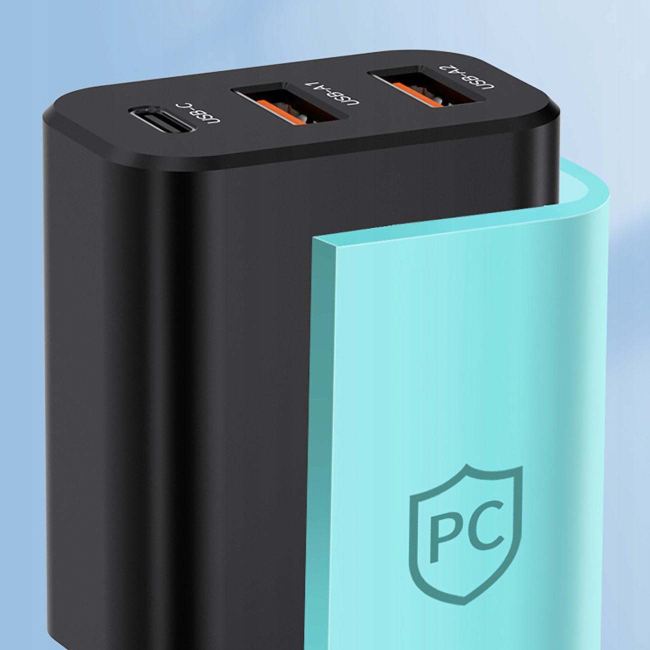 Zbliżenie czarnej ładowarki z wieloma portami USB i osłoną ochronną.