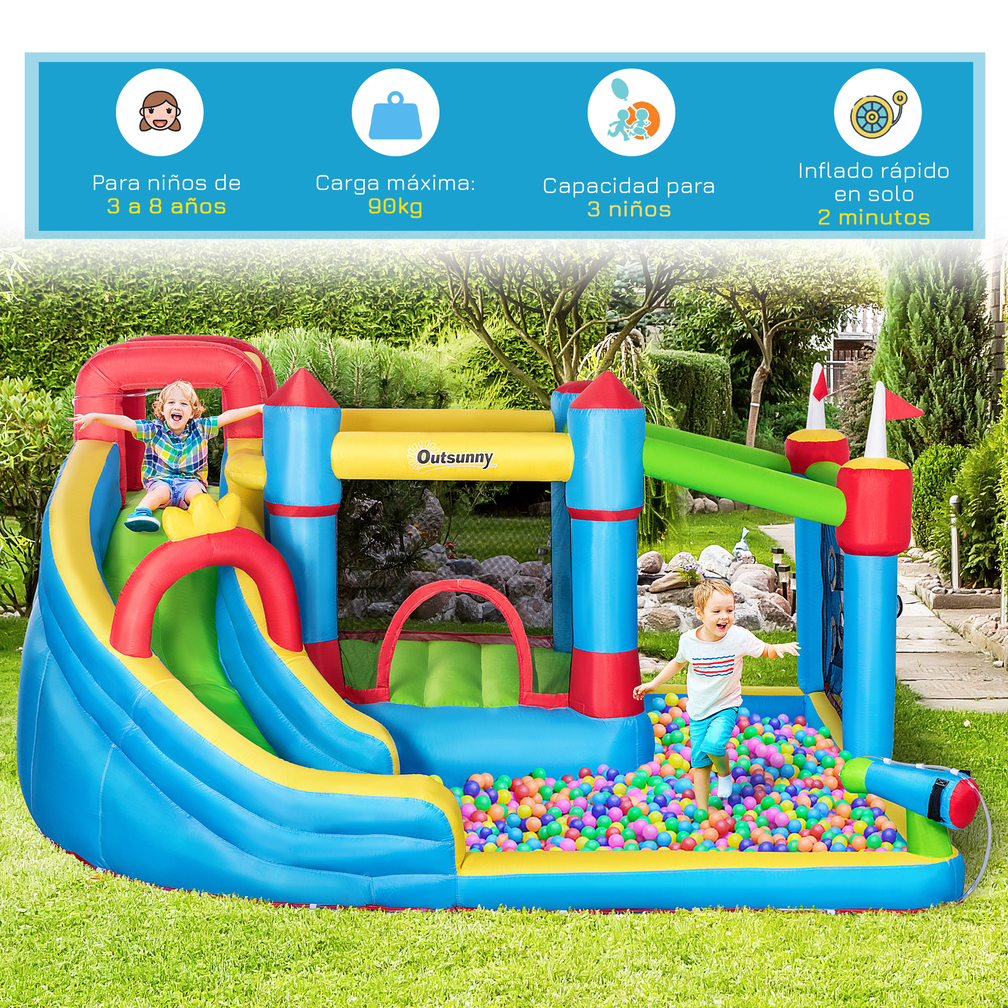 Niños jugando en una colorida casa de rebotes inflable con tobogán y piscina de bolas en un patio trasero.