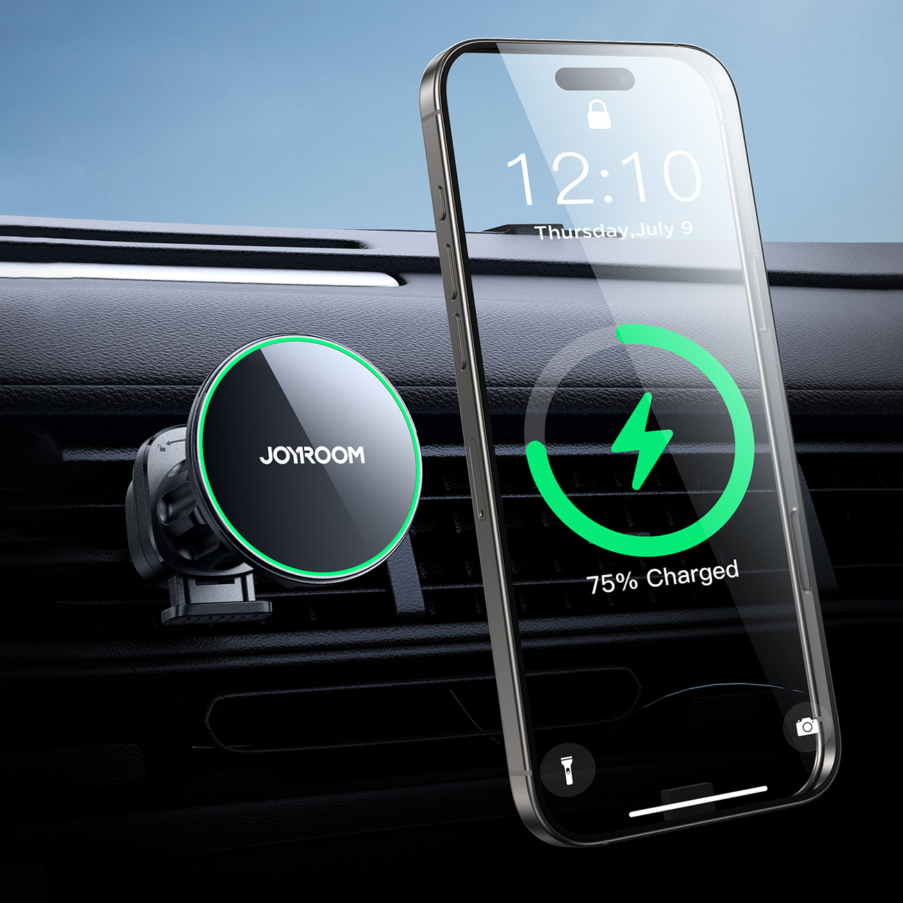 Na zdjęciu widoczny jest telefon zamontowany na magnetycznym uchwycie samochodowym Joyroom, wyświetlający ekran ładowania, przymocowany do kratki wentylacyjnej samochodu.