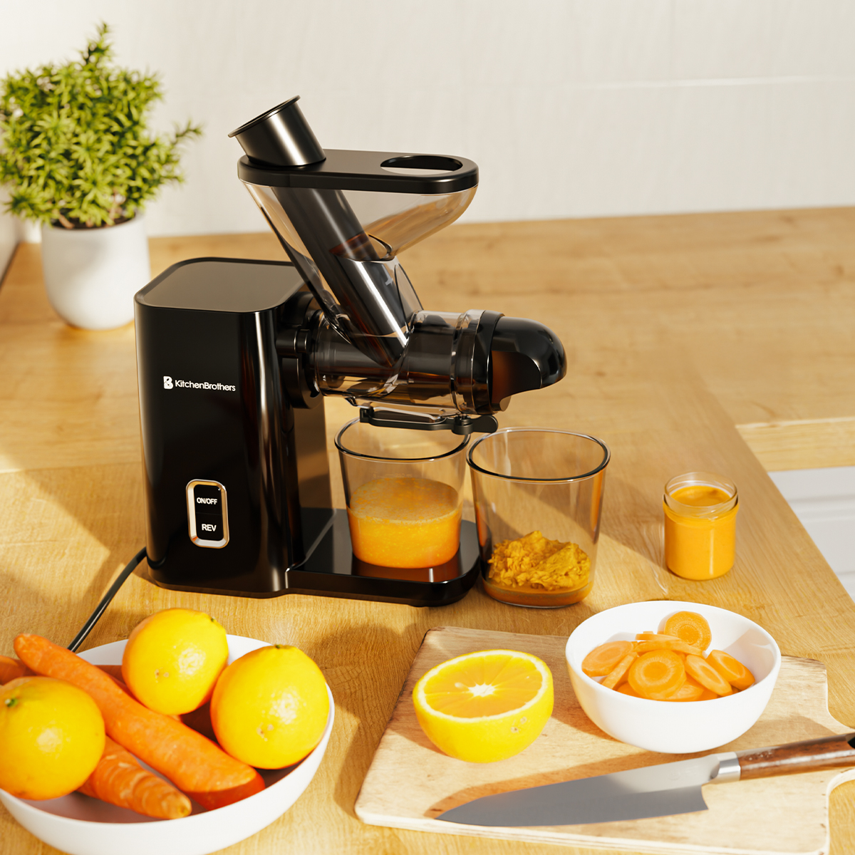 A black KitchenBrothers juicer with fruits, vegetables and juice around.