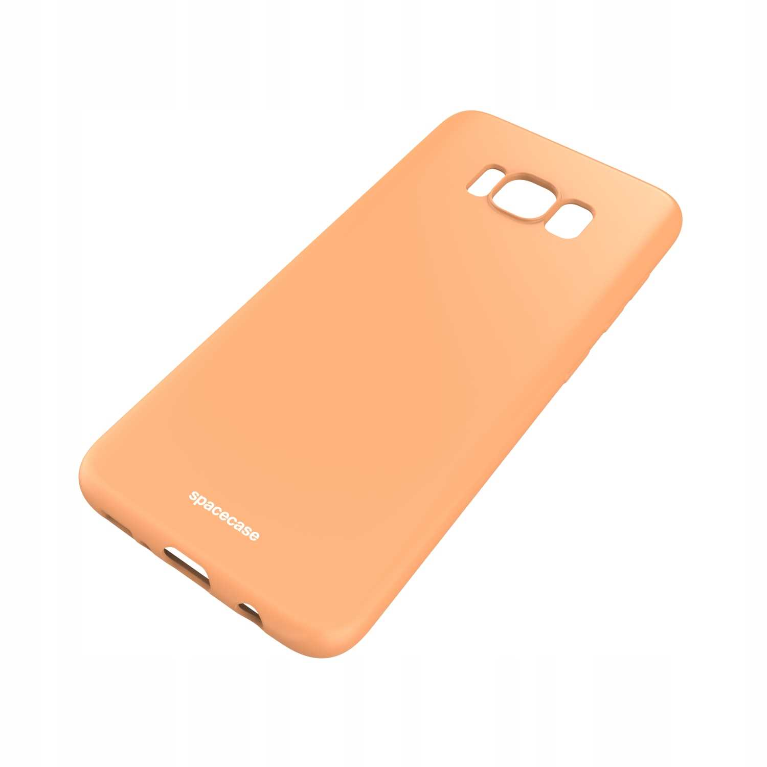 Brzoskwiniowe etui na telefon „spacecase” na białym tle, prezentujące otwory na aparat i elegancki wygląd.