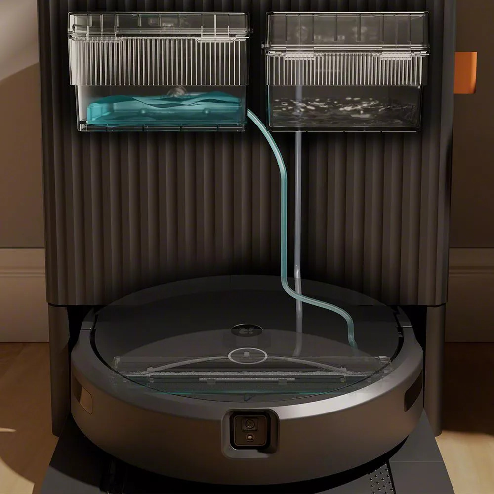 Un robot aspirador gris con dos tanques de agua, uno azul y otro sucio.